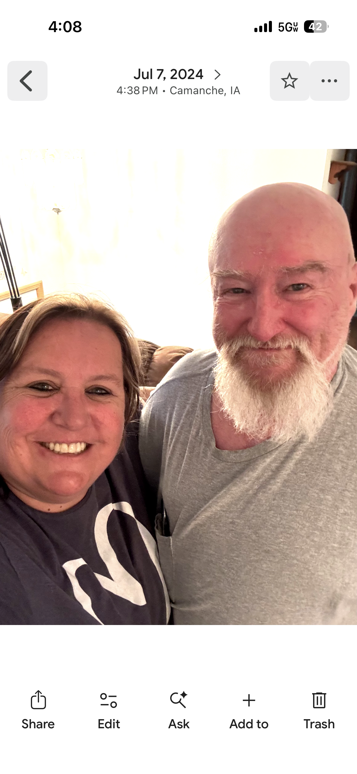 A man and woman taking a selfie