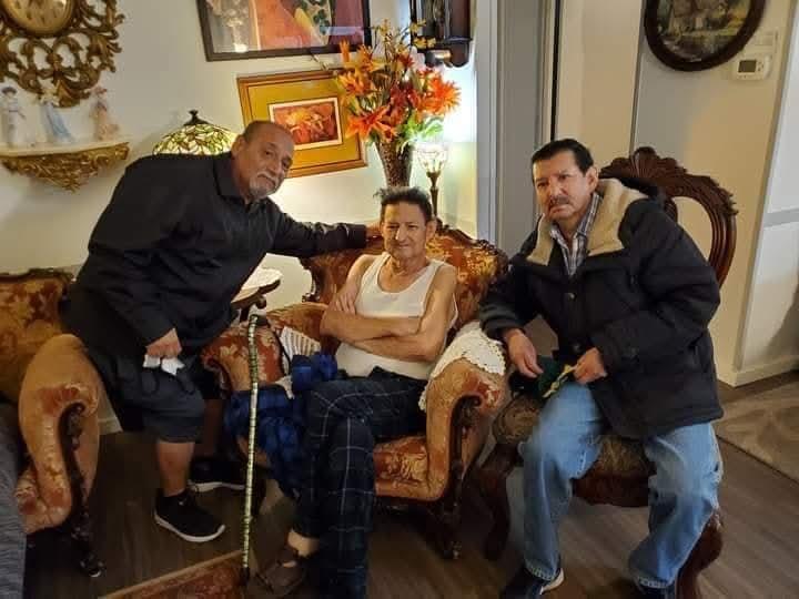 A group of people sitting in a chair