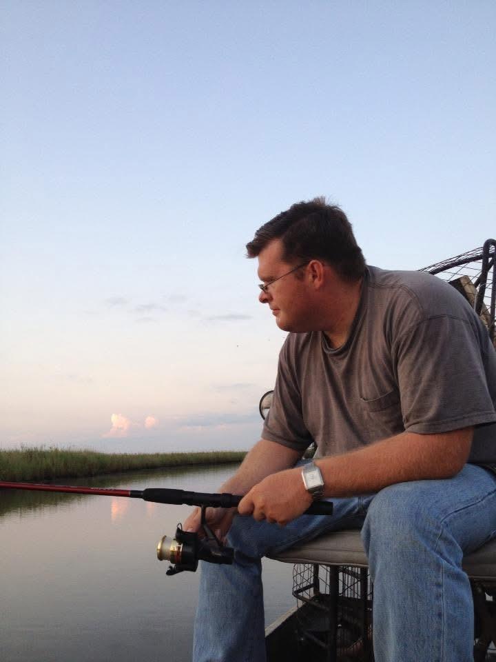 A man fishing on a boat