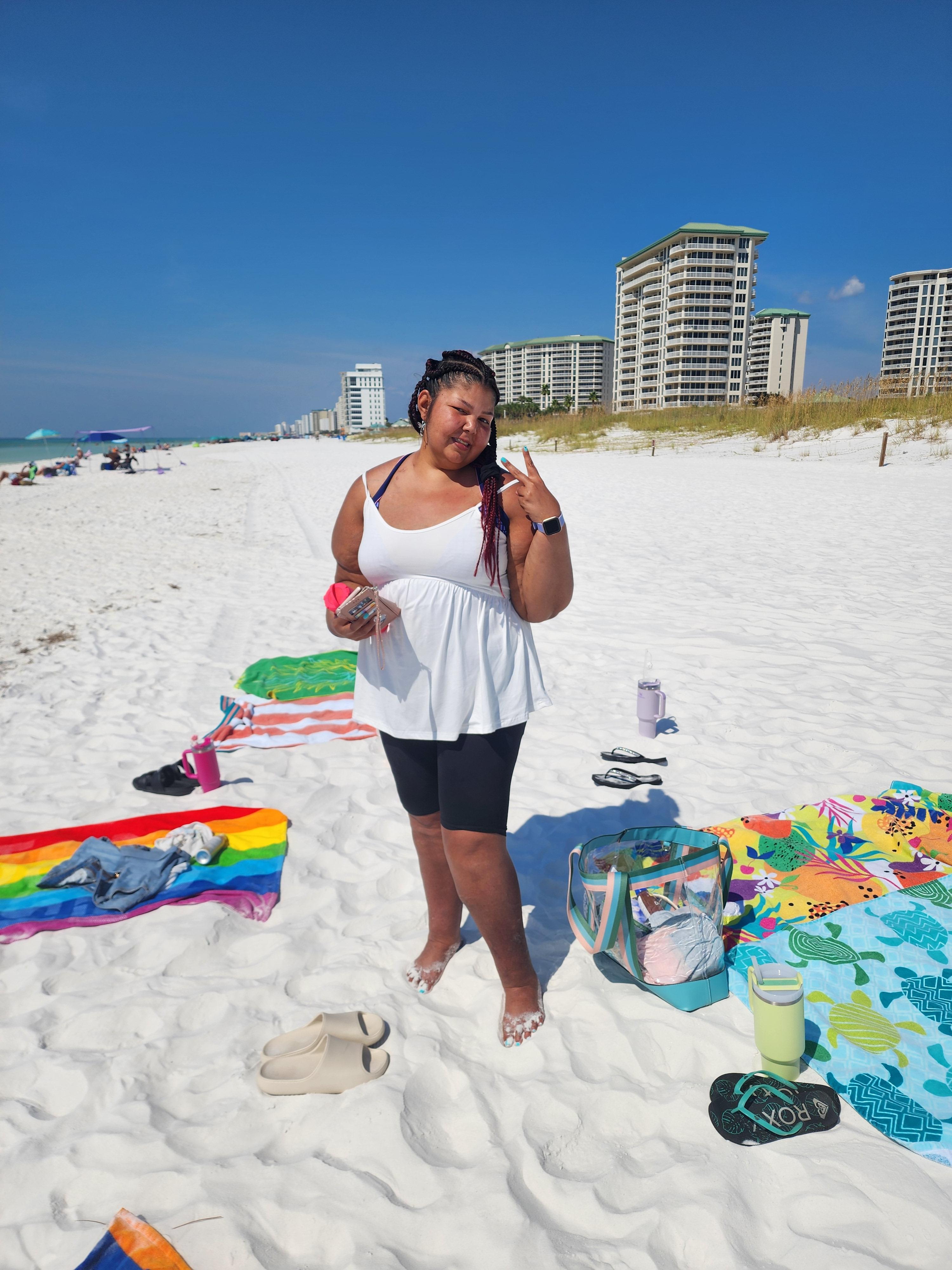 A woman standing on a beach