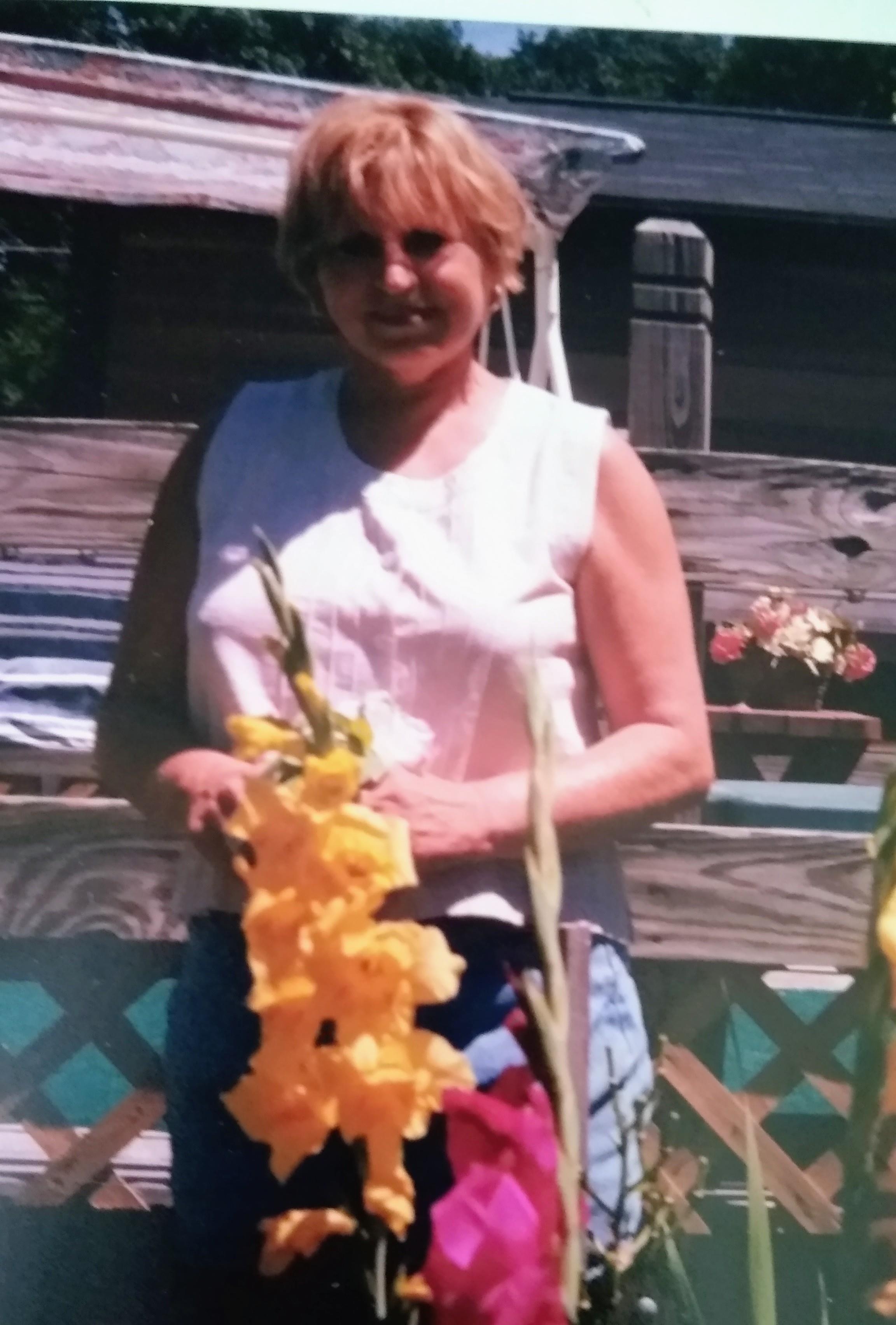 A woman standing in front of a bench