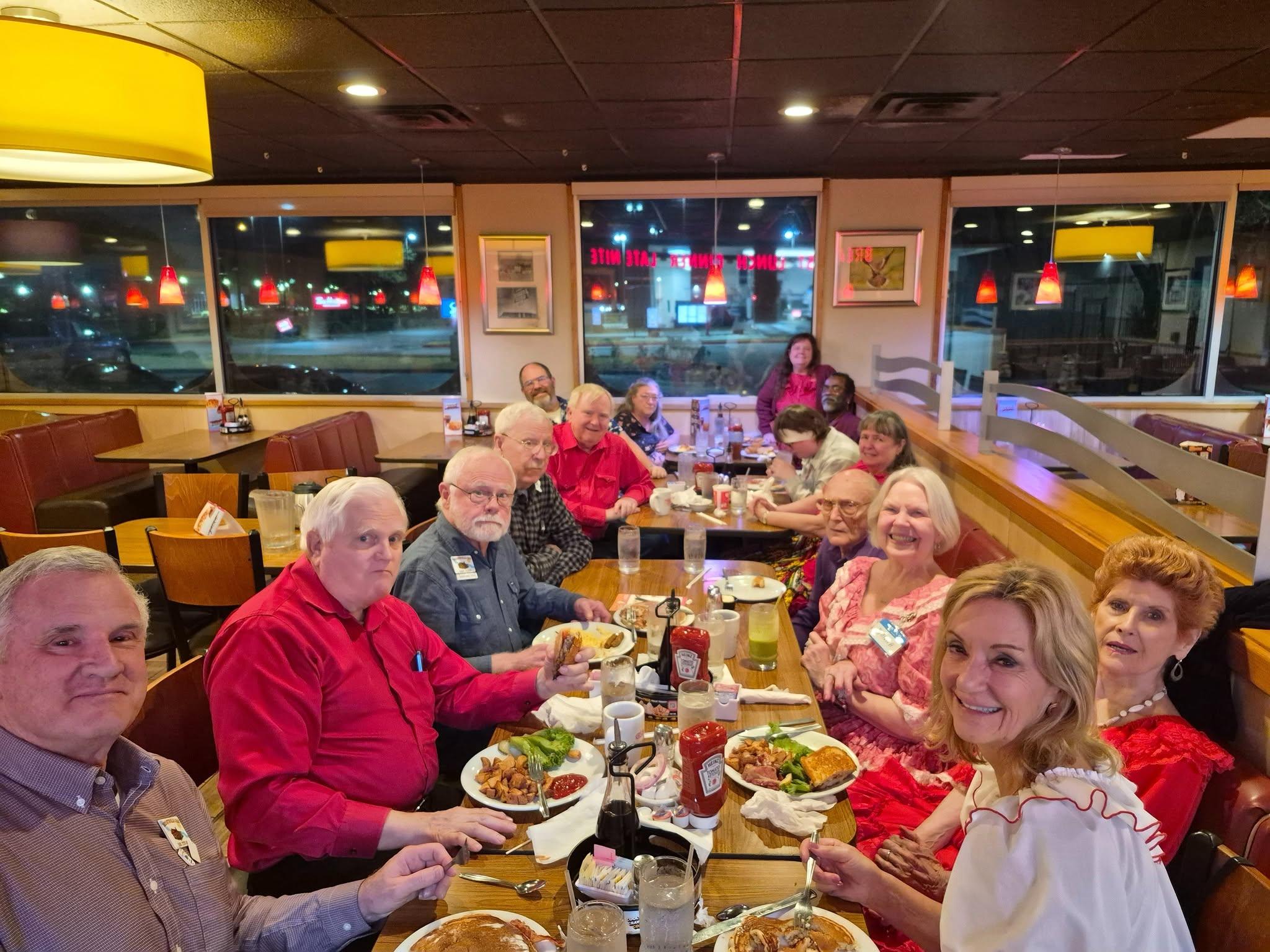 A group of people sitting at a table