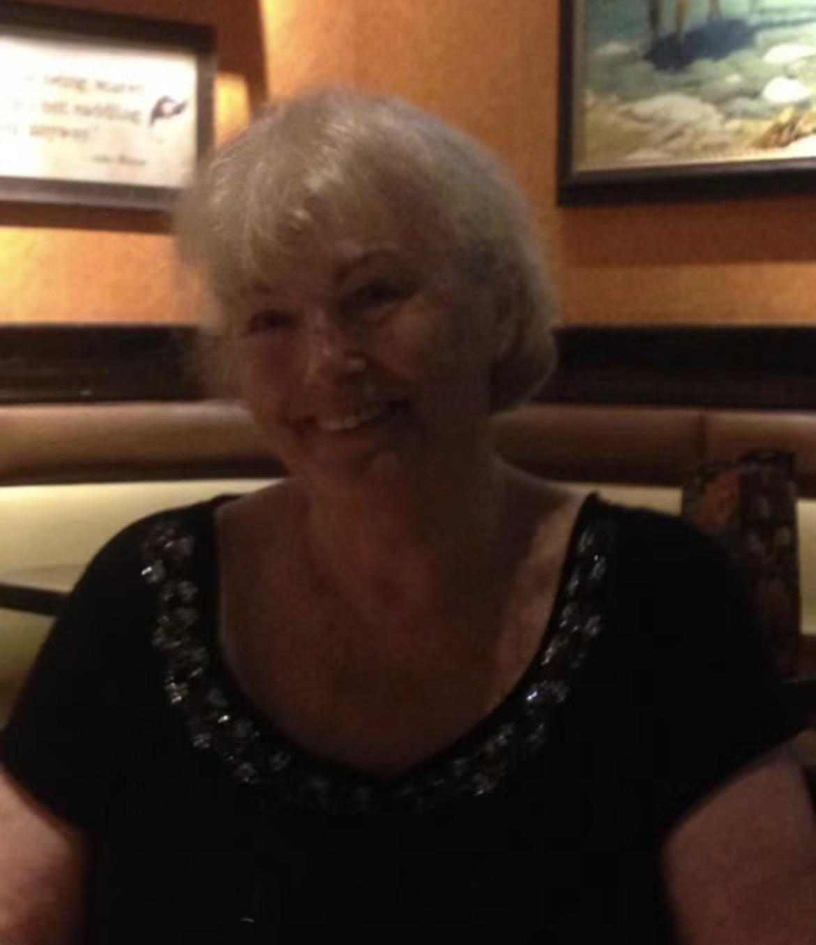A woman sitting in a restaurant