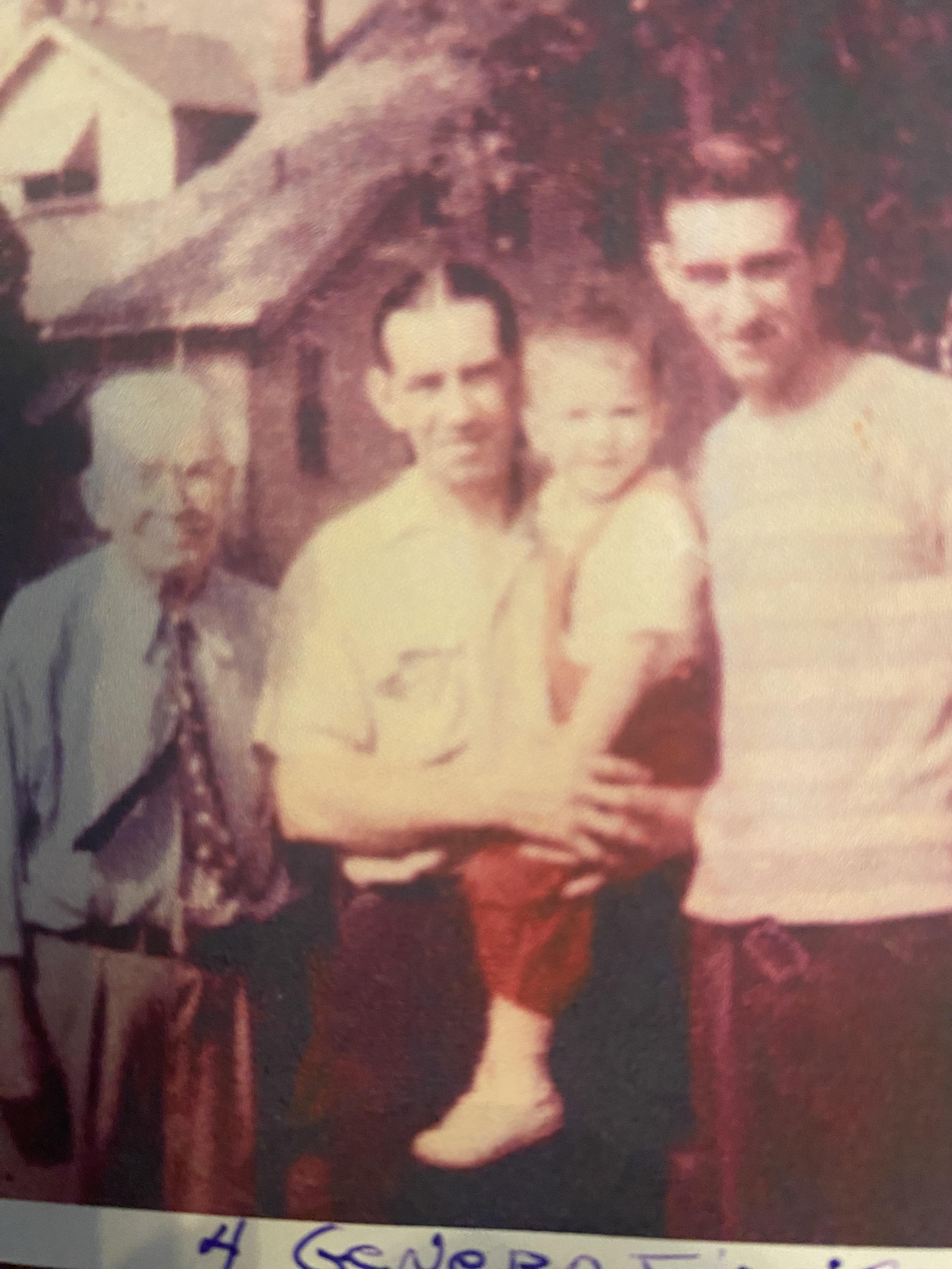 A group of men and a child