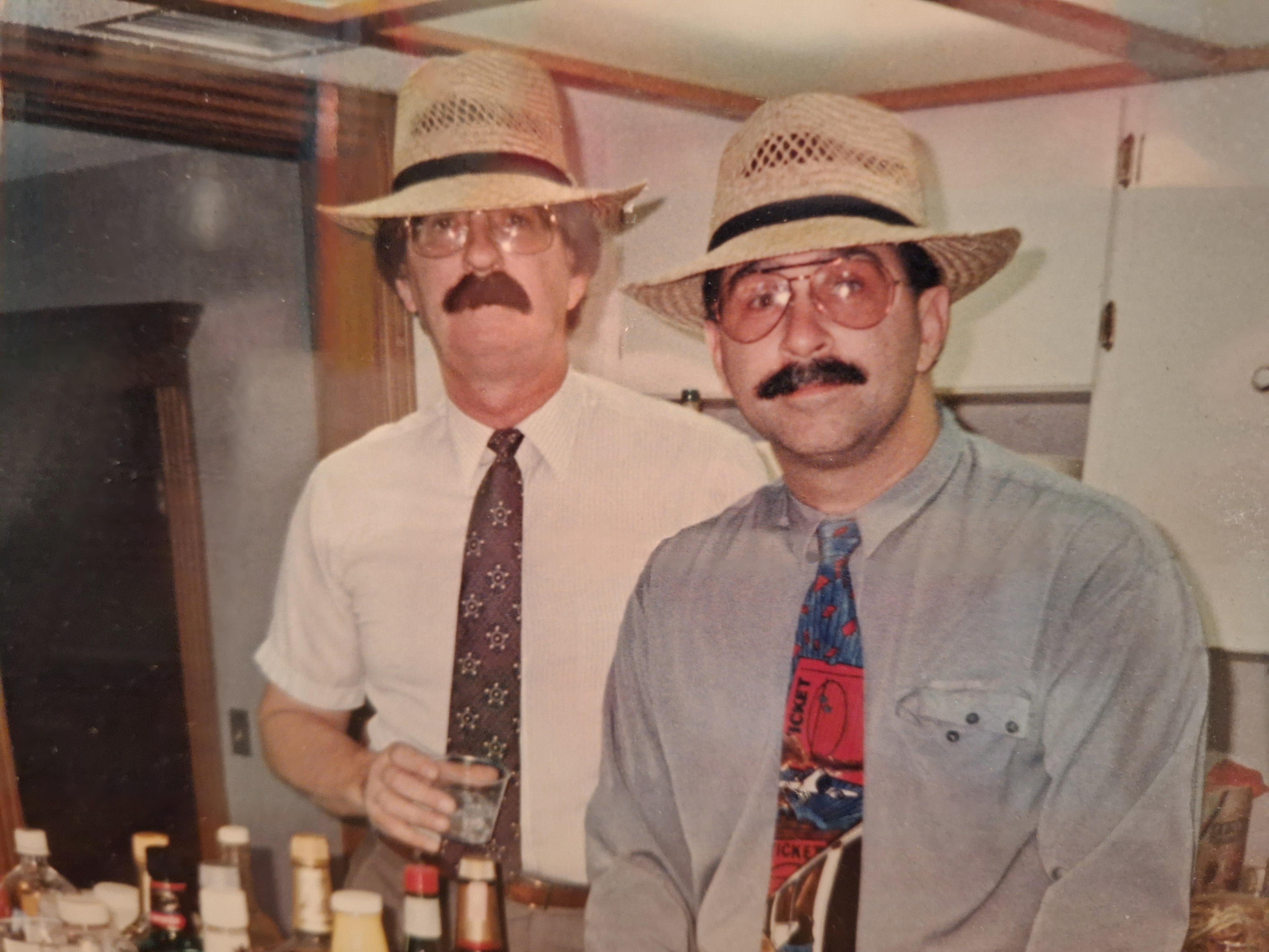 A couple of men wearing hats