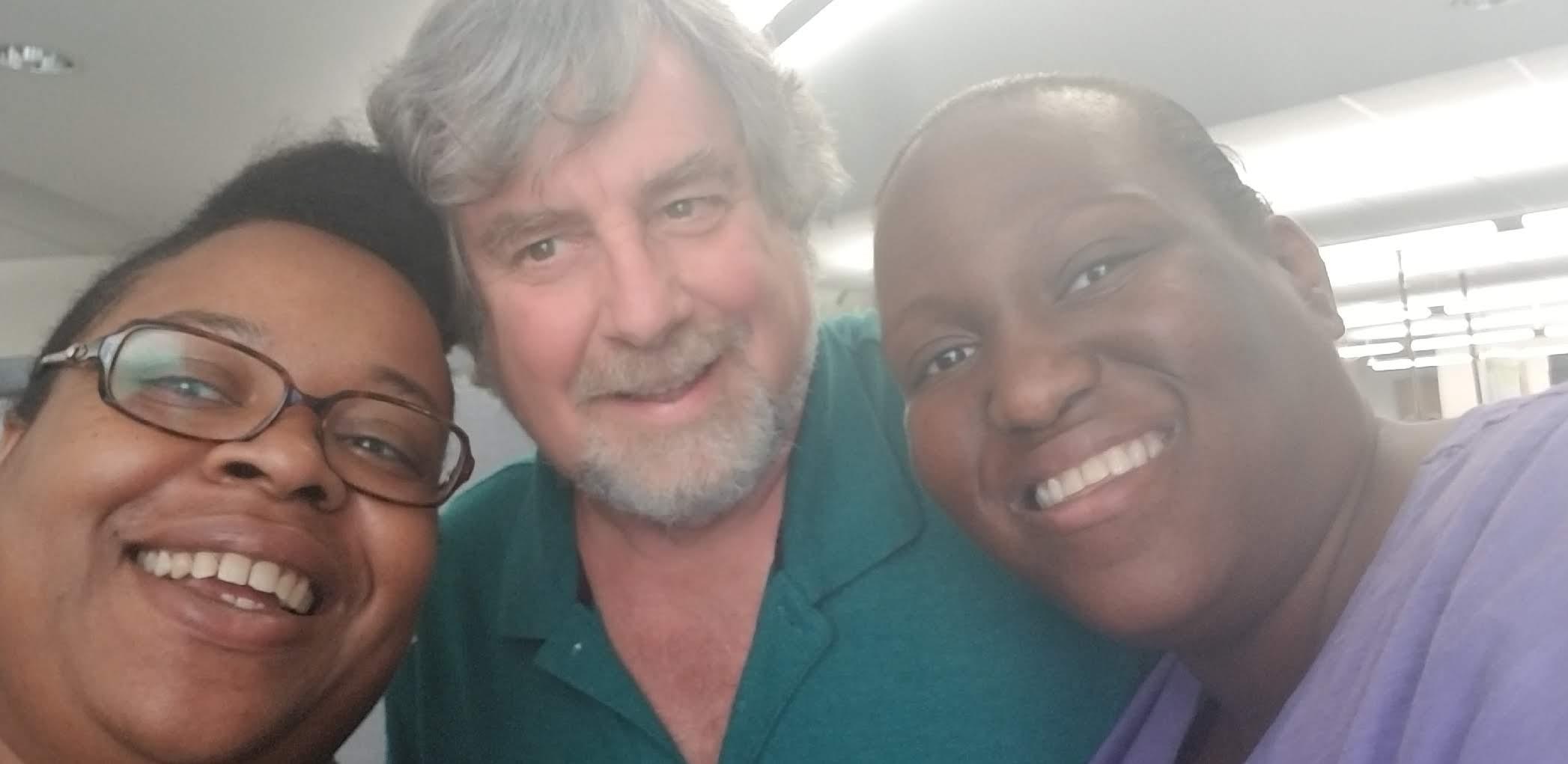 A group of people posing for a selfie