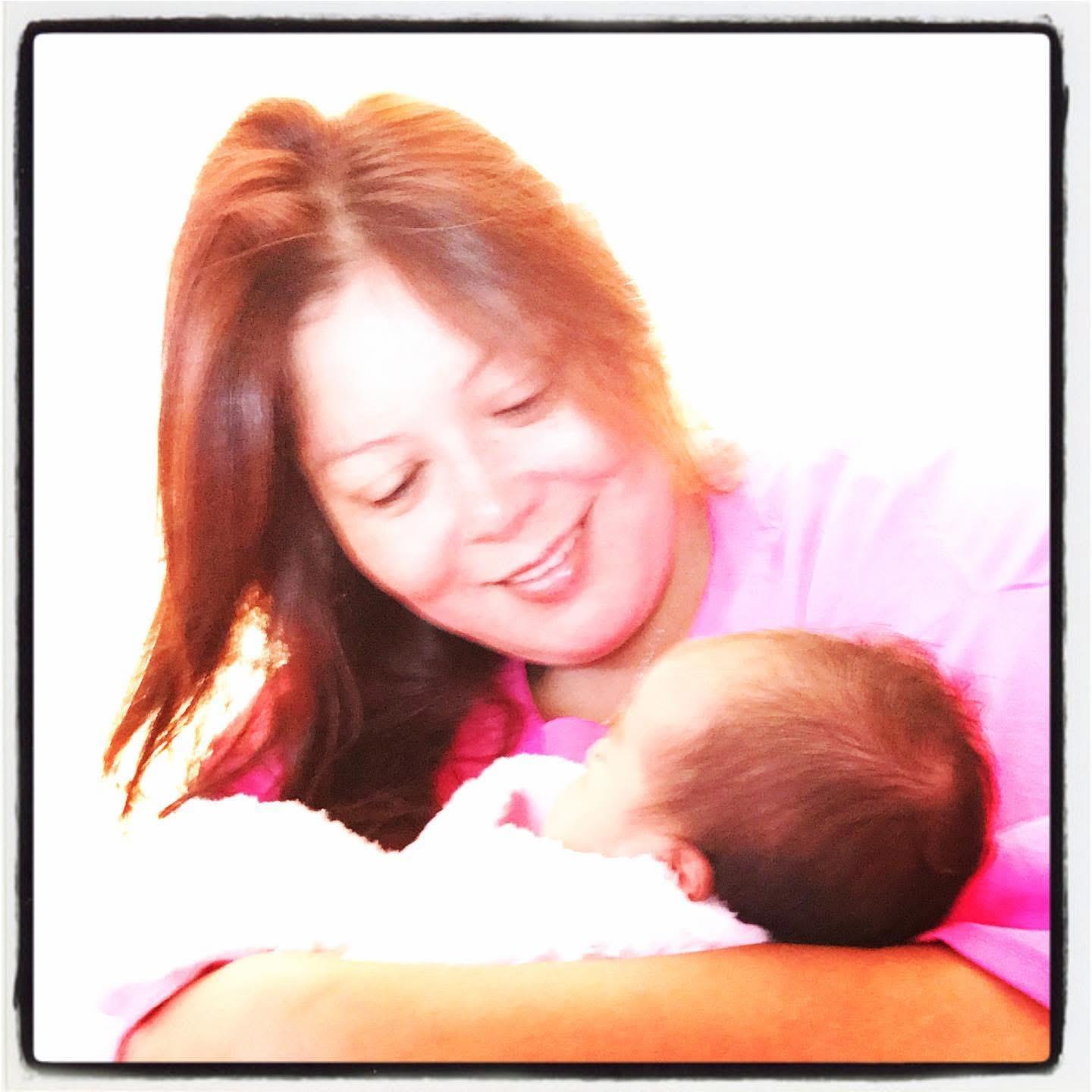 A woman holding a baby