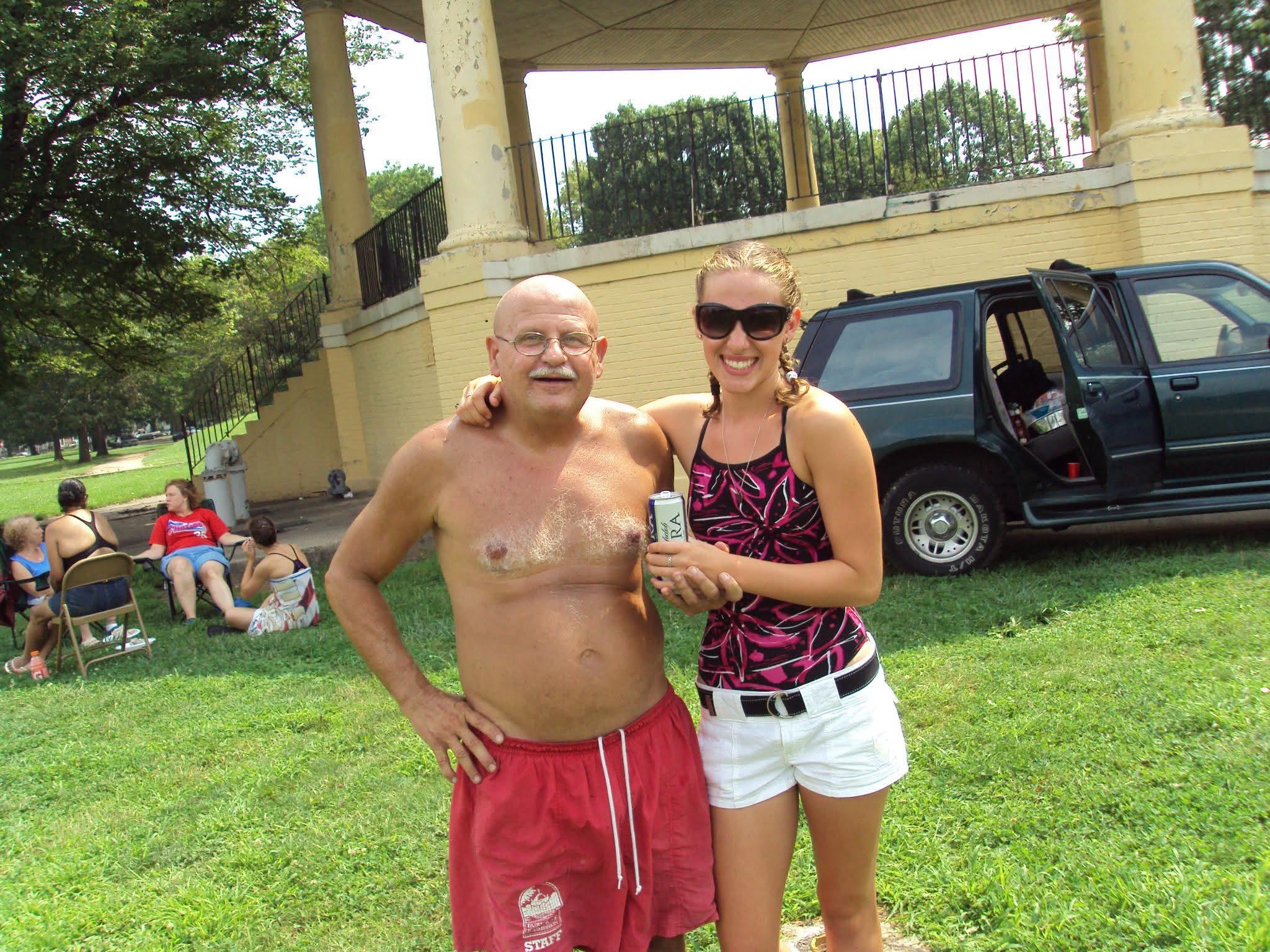 A man and woman standing in a park
