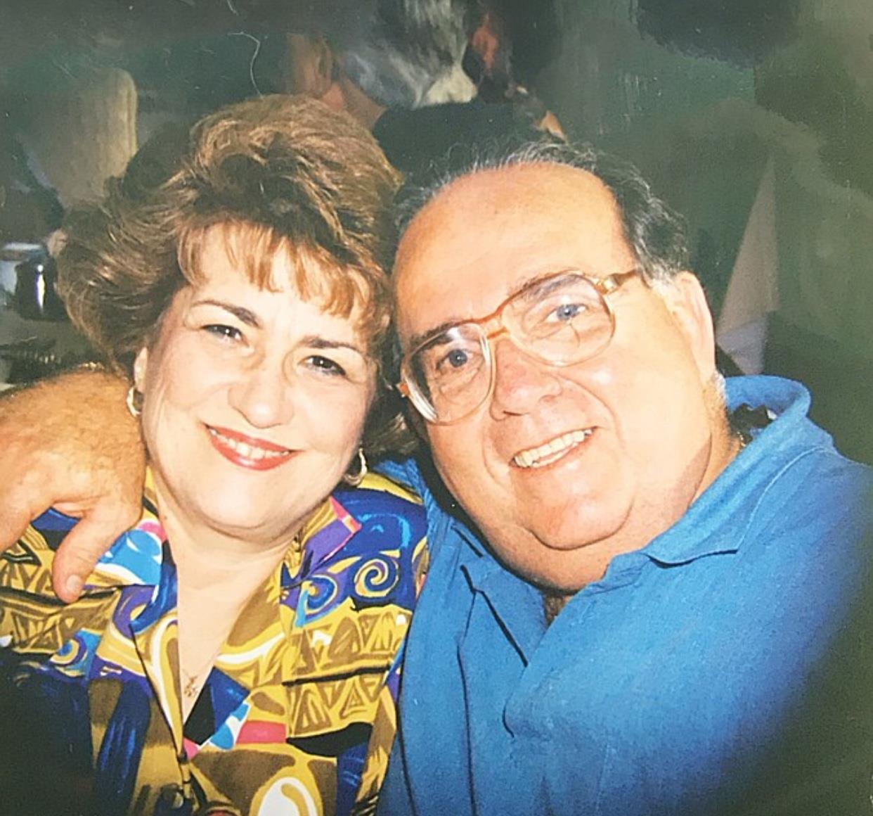 A man and woman smiling for a picture