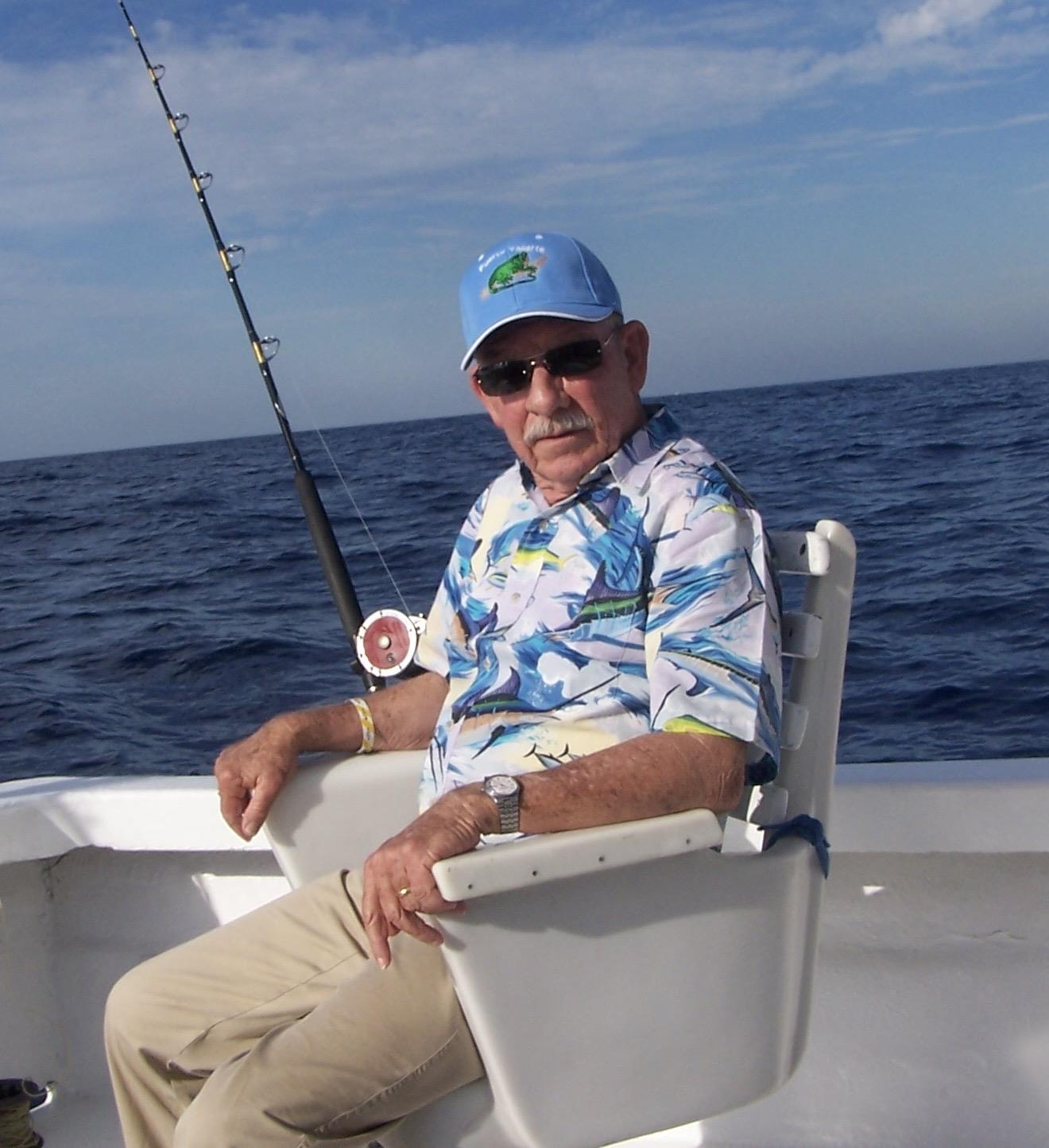 A man sitting in a chair on a boat