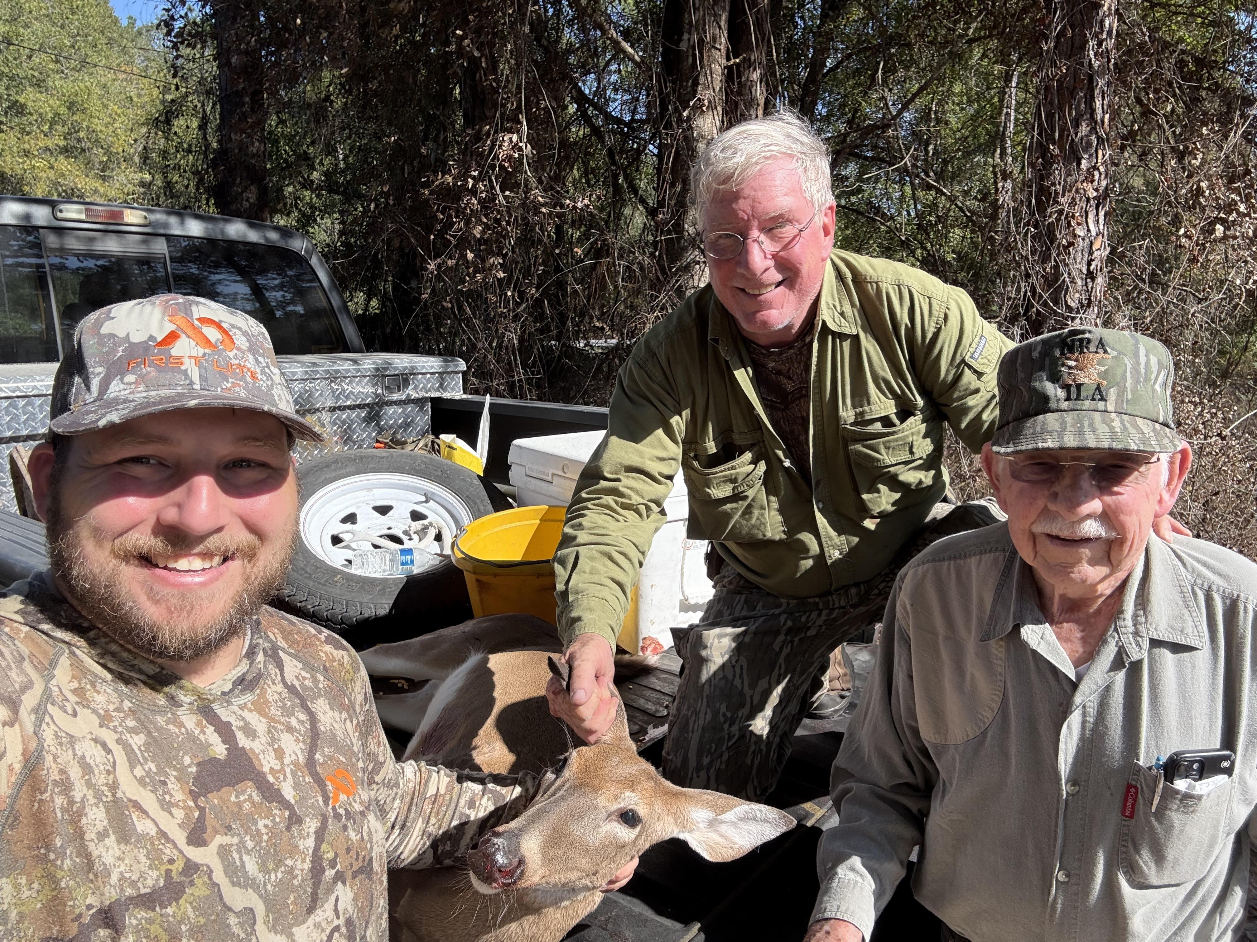 A group of men with deer