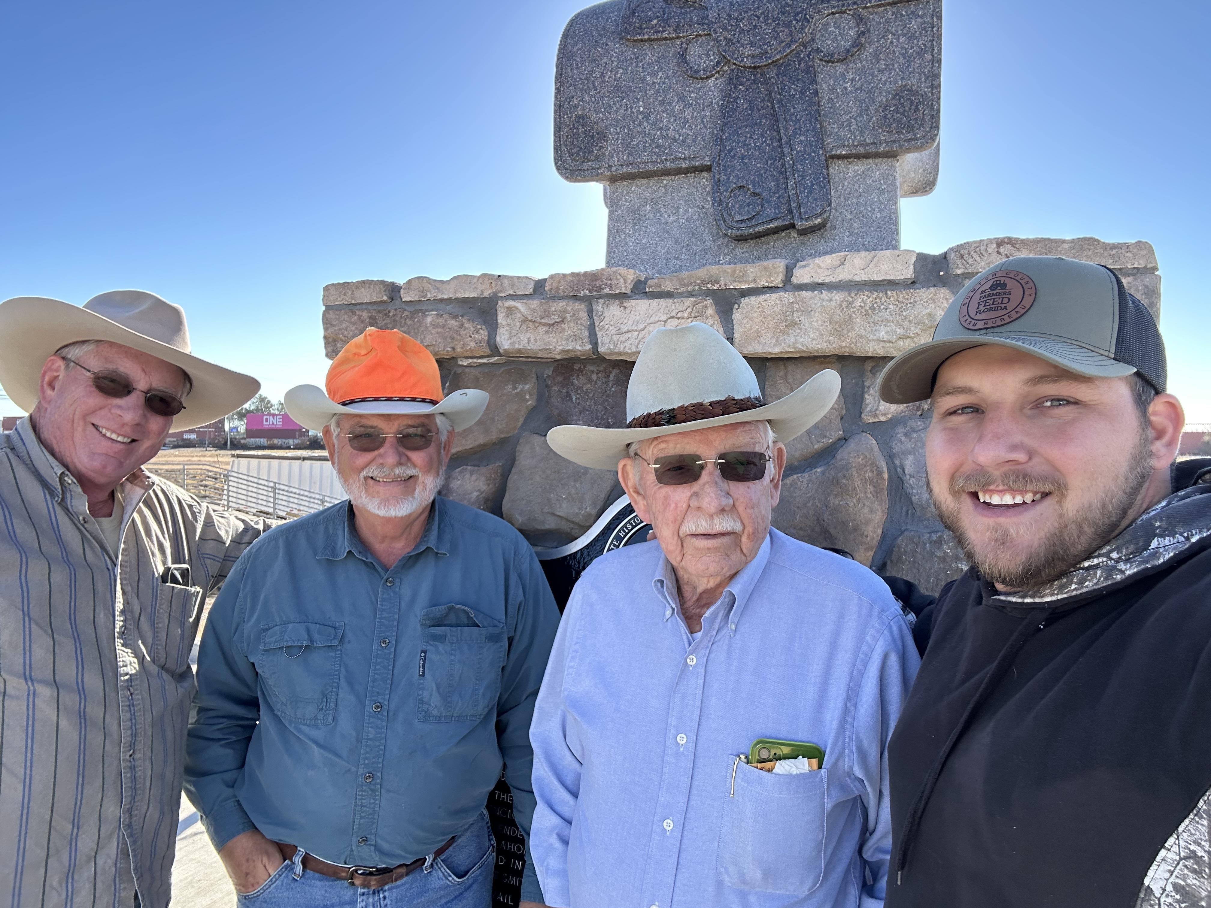 A group of men wearing cowboy hats