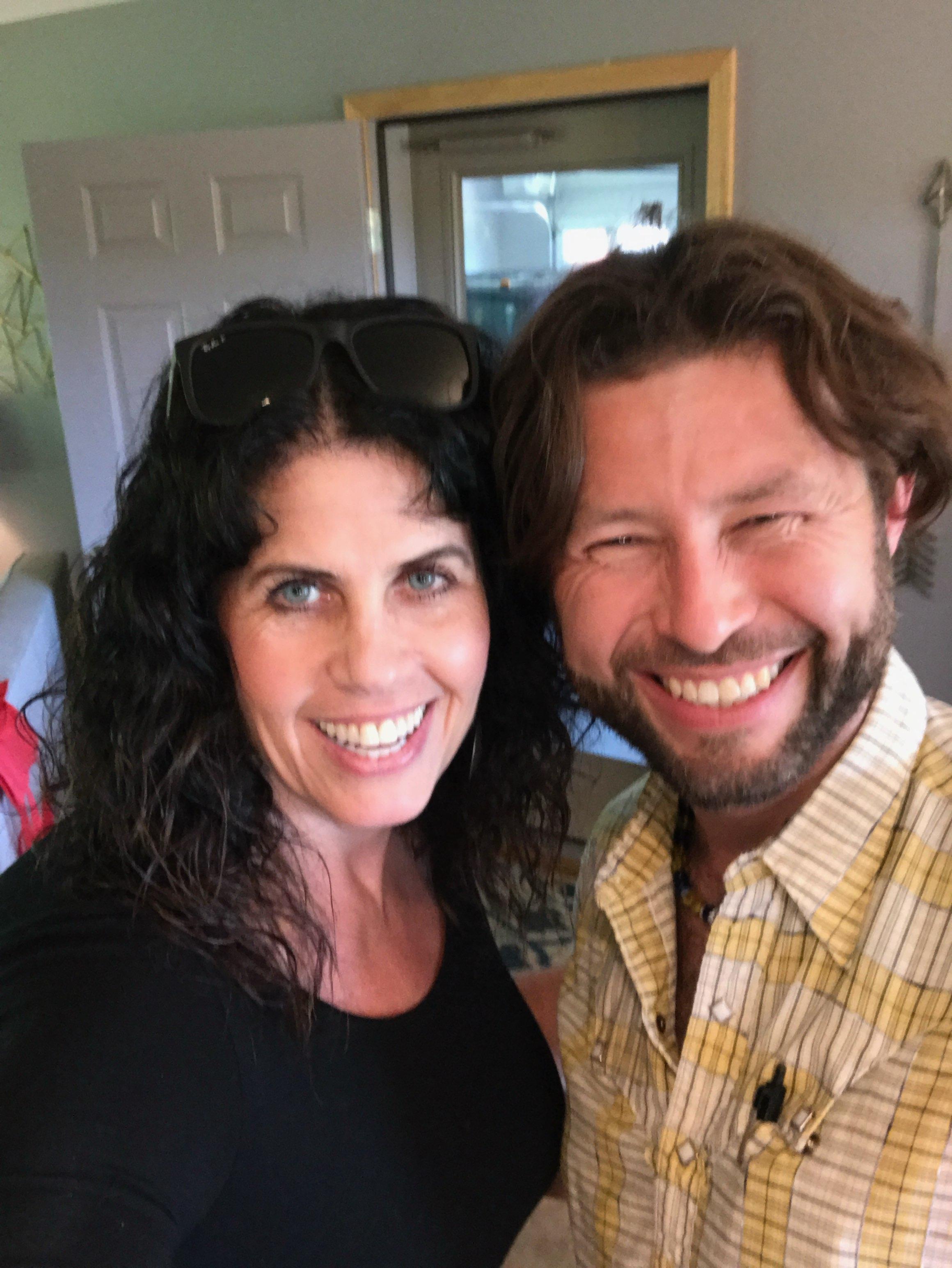 A man and woman smiling for a selfie