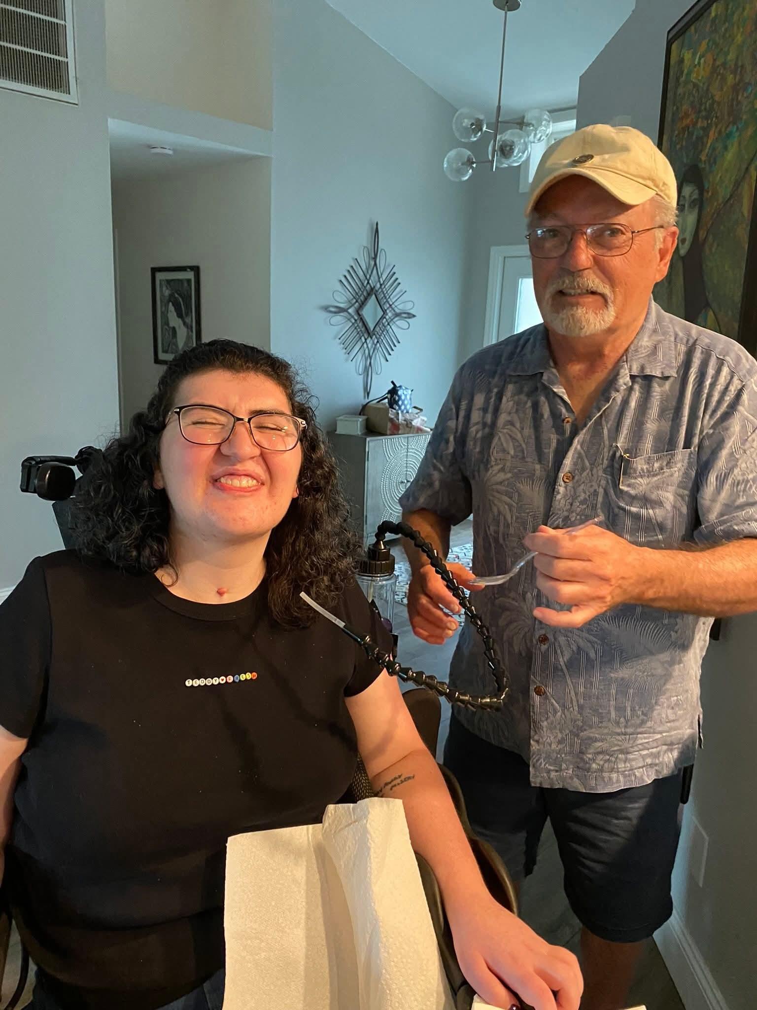 A man and woman sitting in a chair