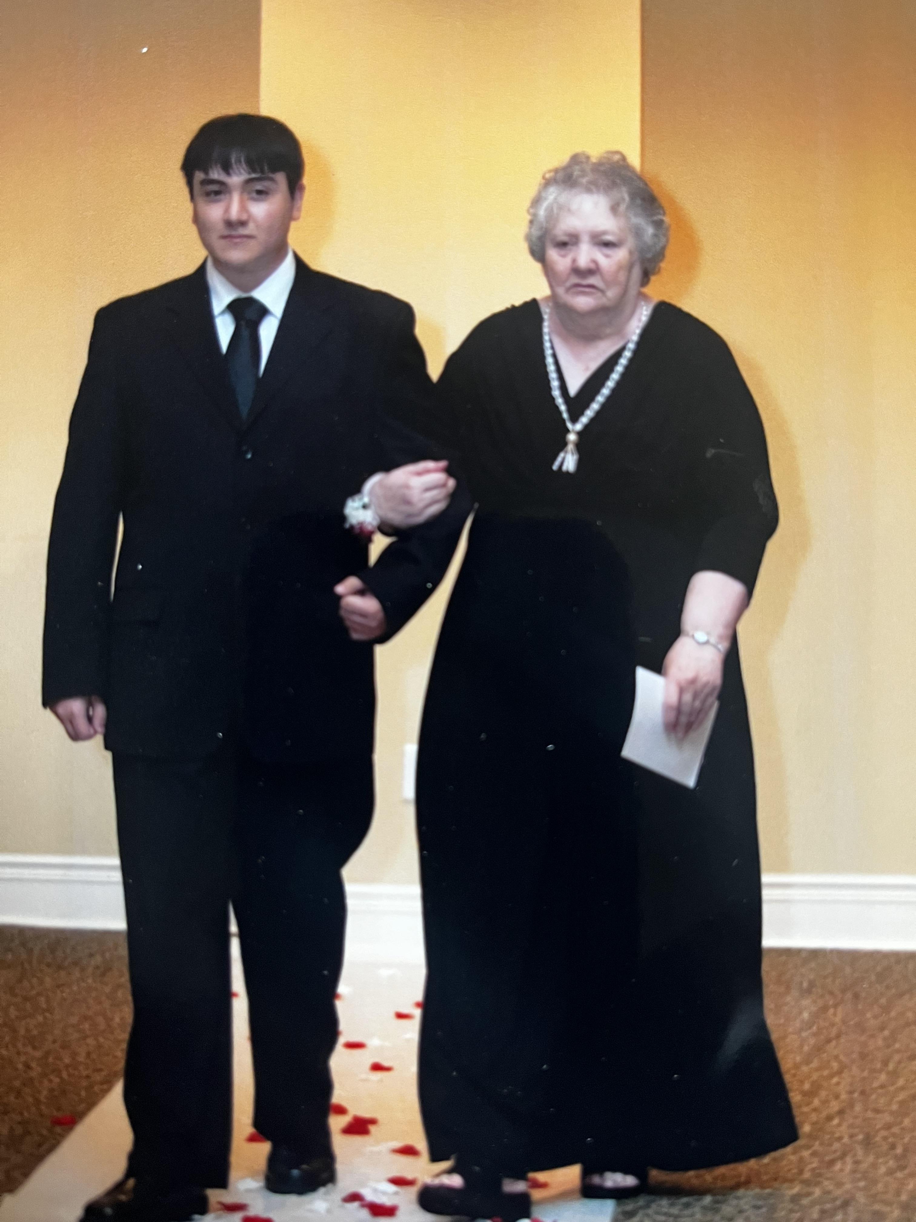A man and woman in black suits
