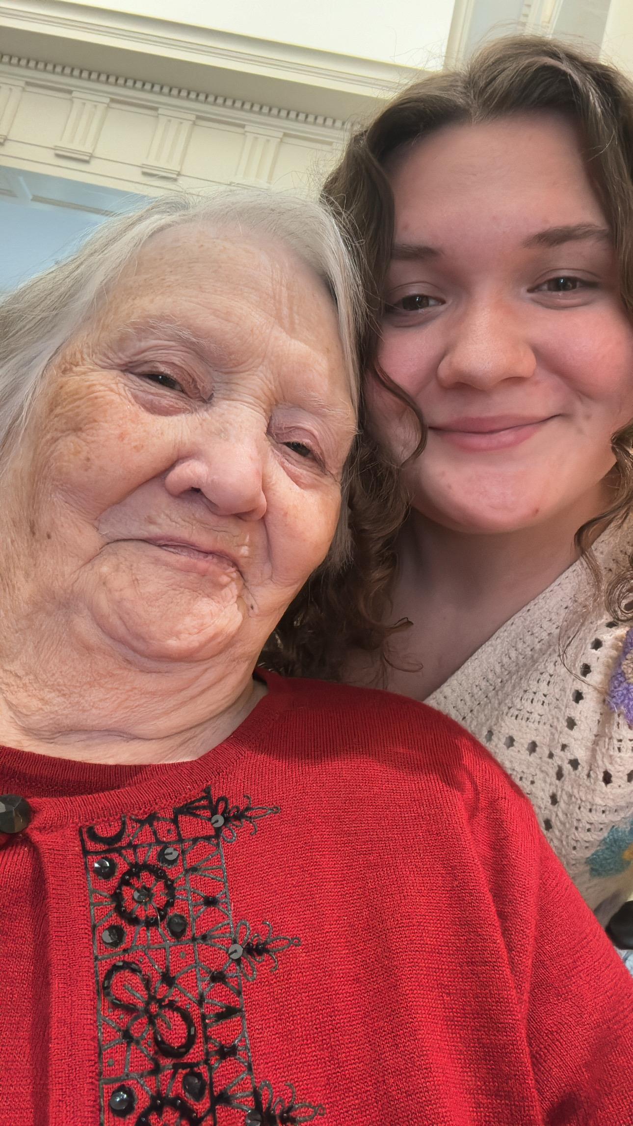 A woman and a young girl taking a selfie