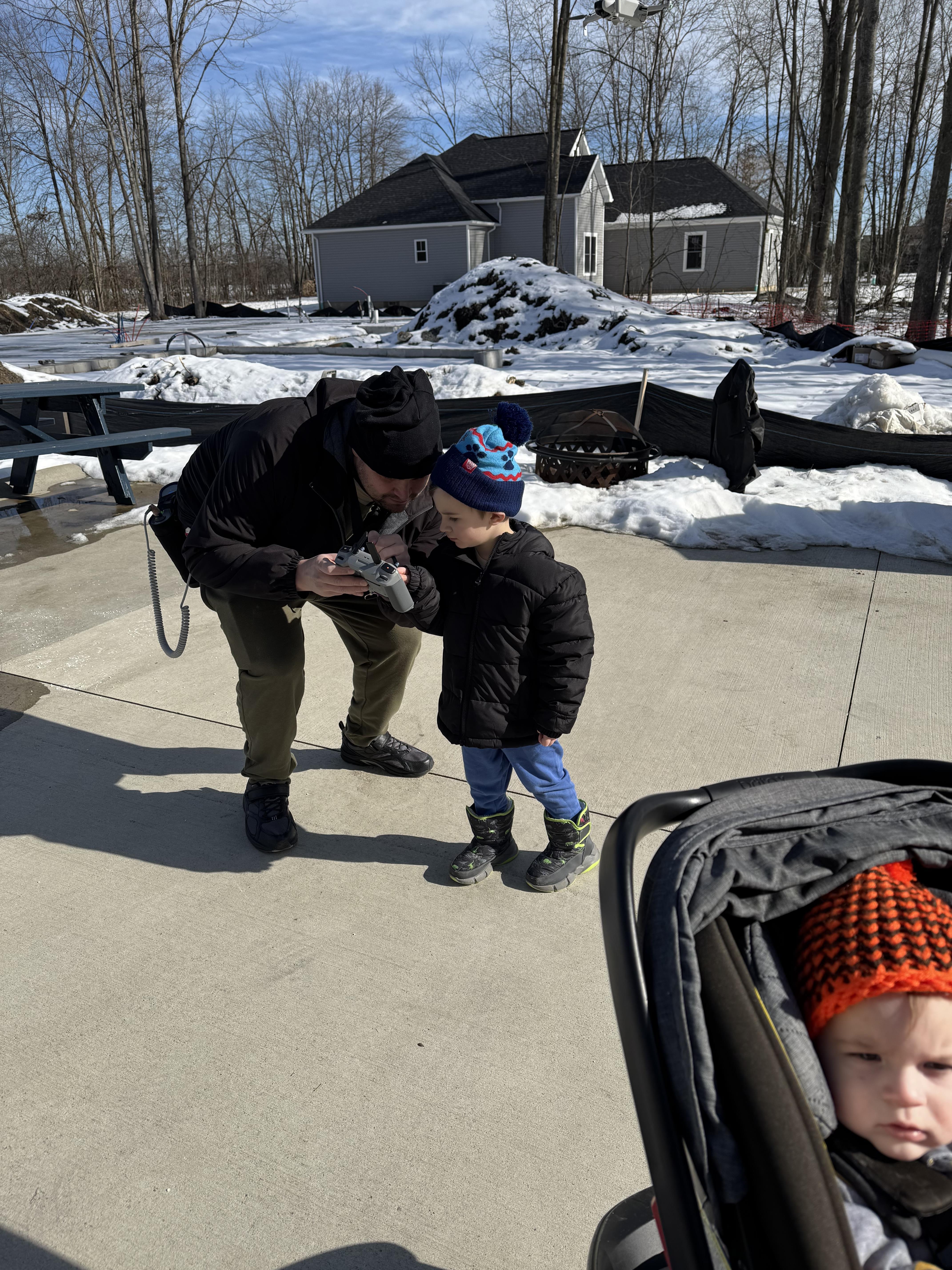 A man holding a gun to a child's face
