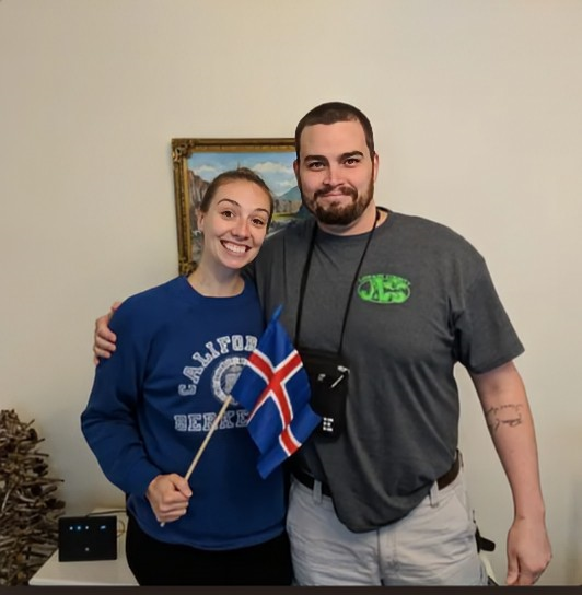 A man and woman posing for a picture