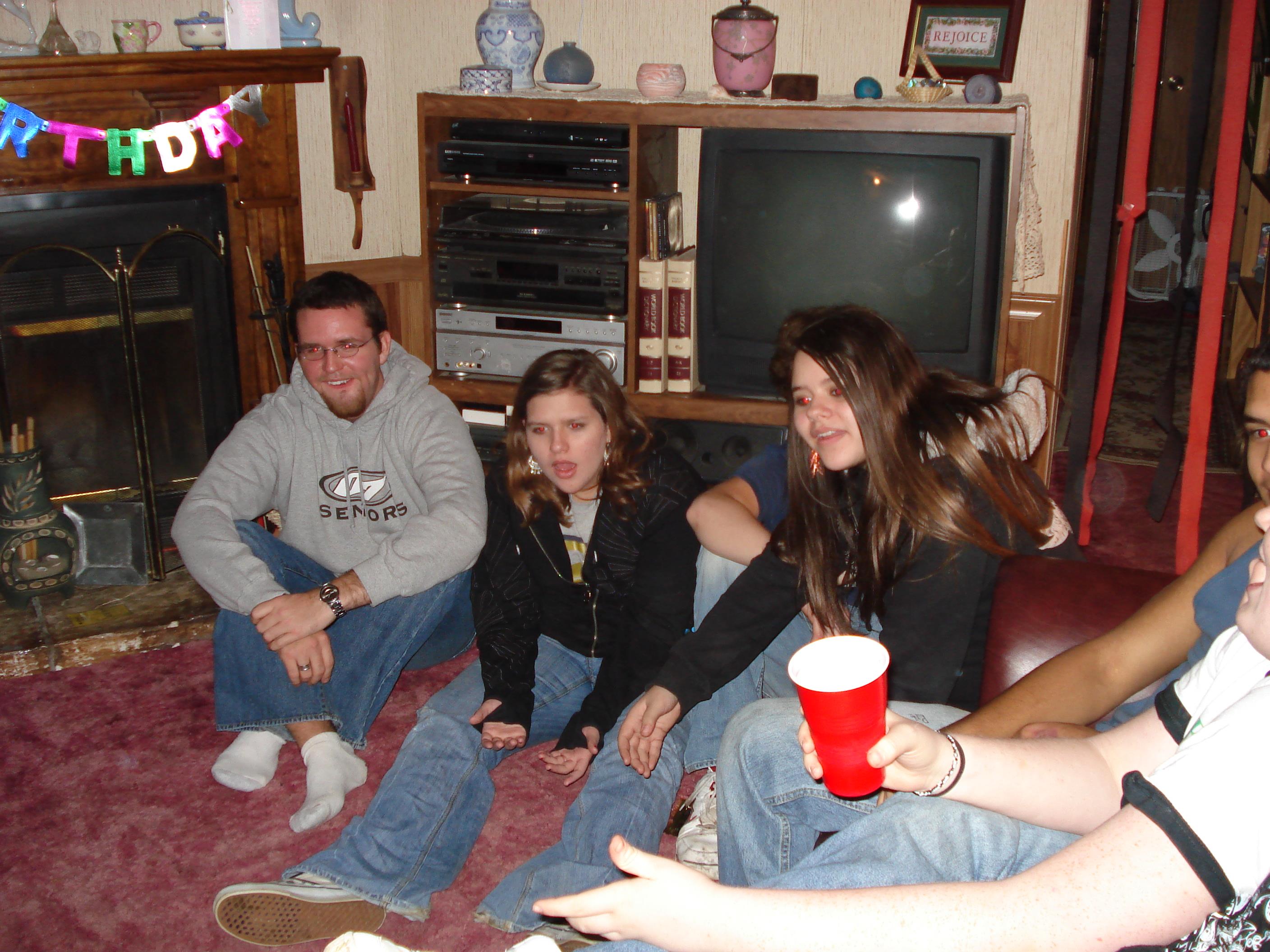 A group of people sitting on the floor