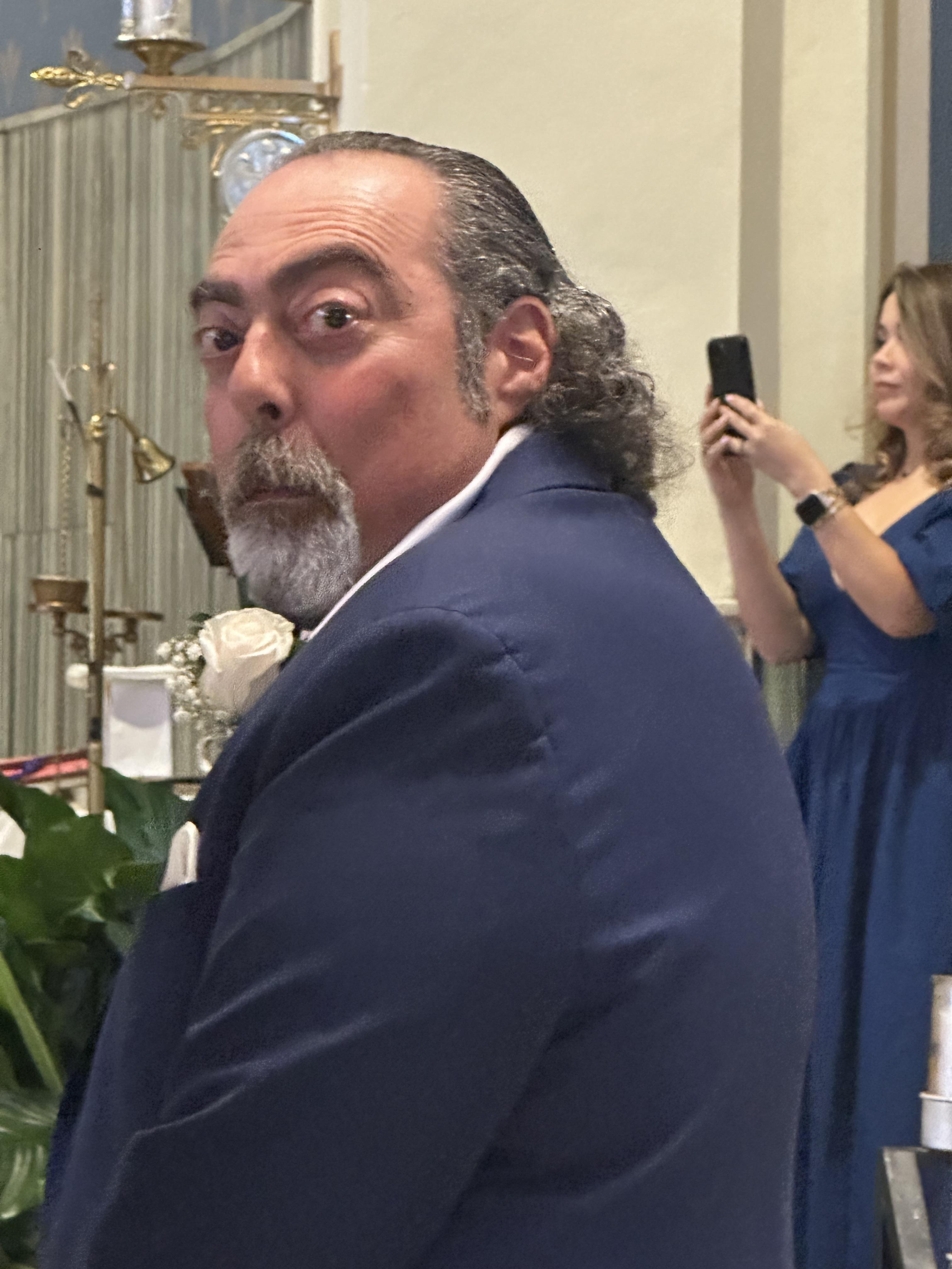 A man in a blue suit