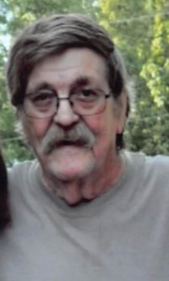 A man with glasses and a mustache