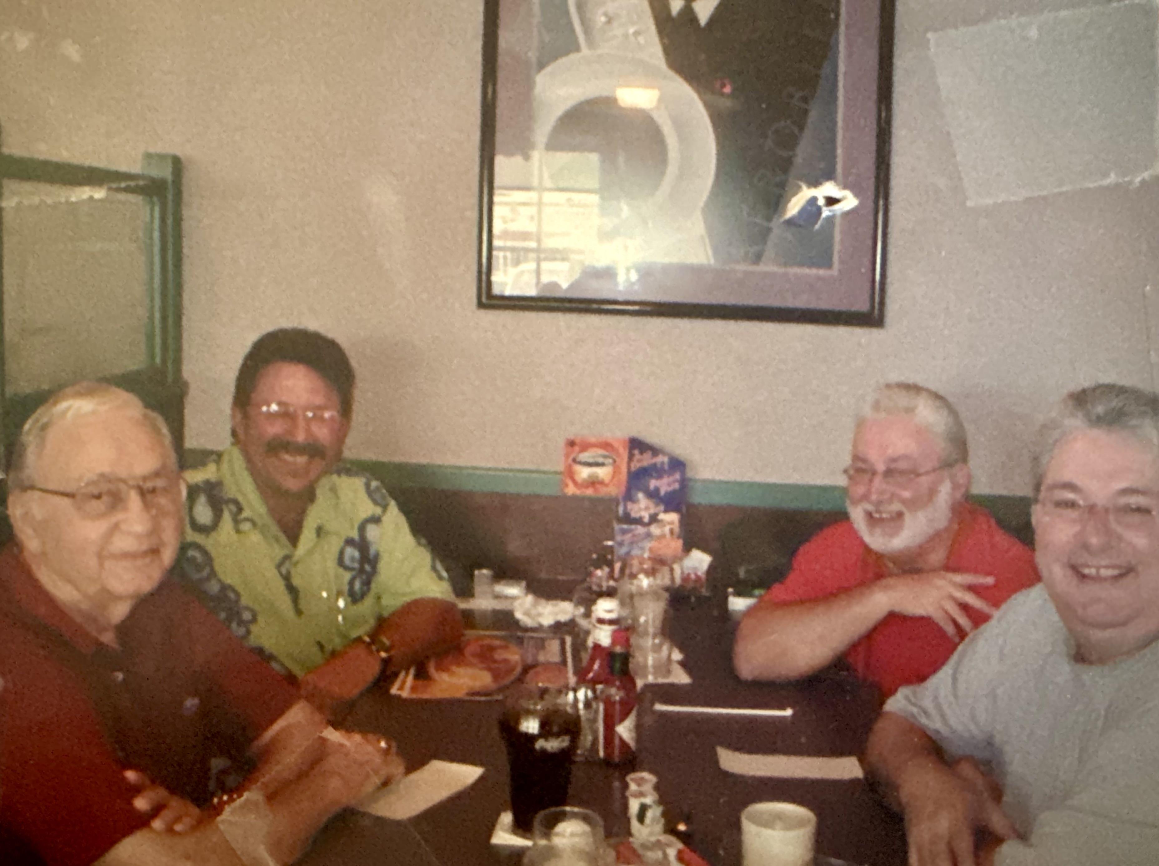 A group of men sitting at a table