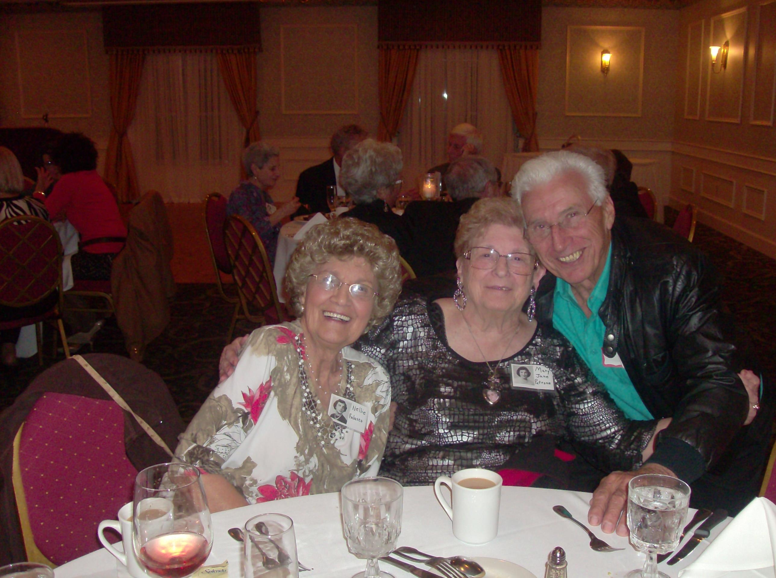 A group of old people at a dinner table