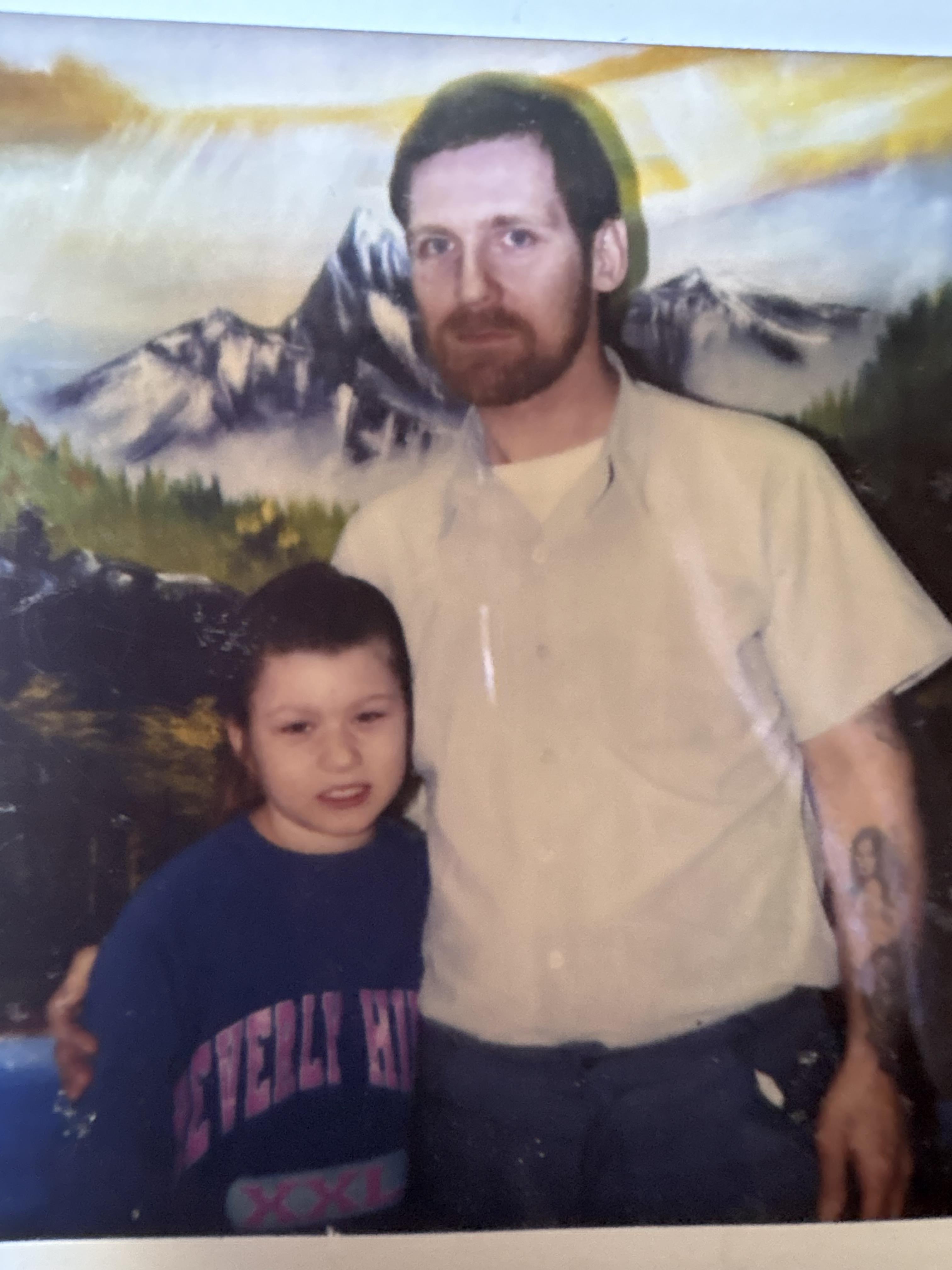 A man and child posing for a picture