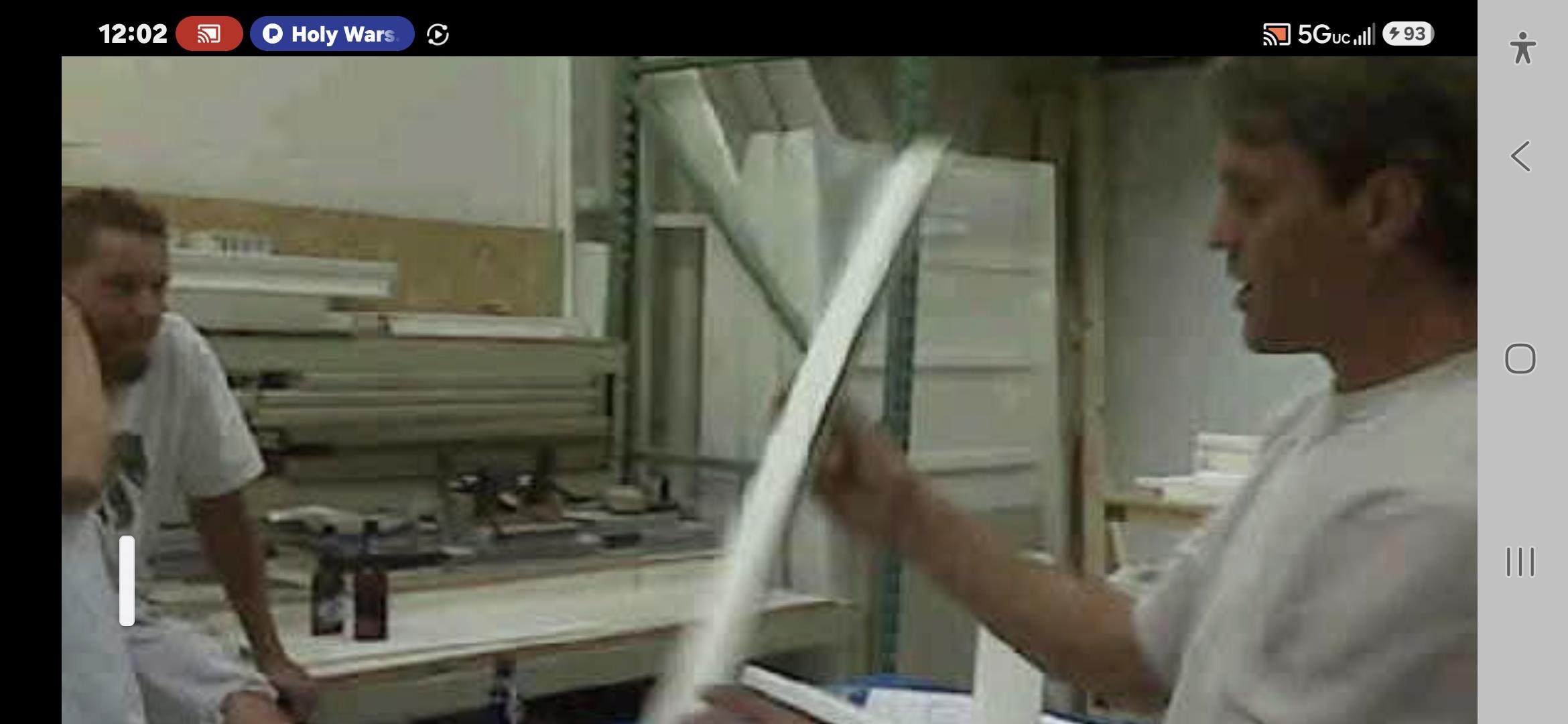 A person holding a white object