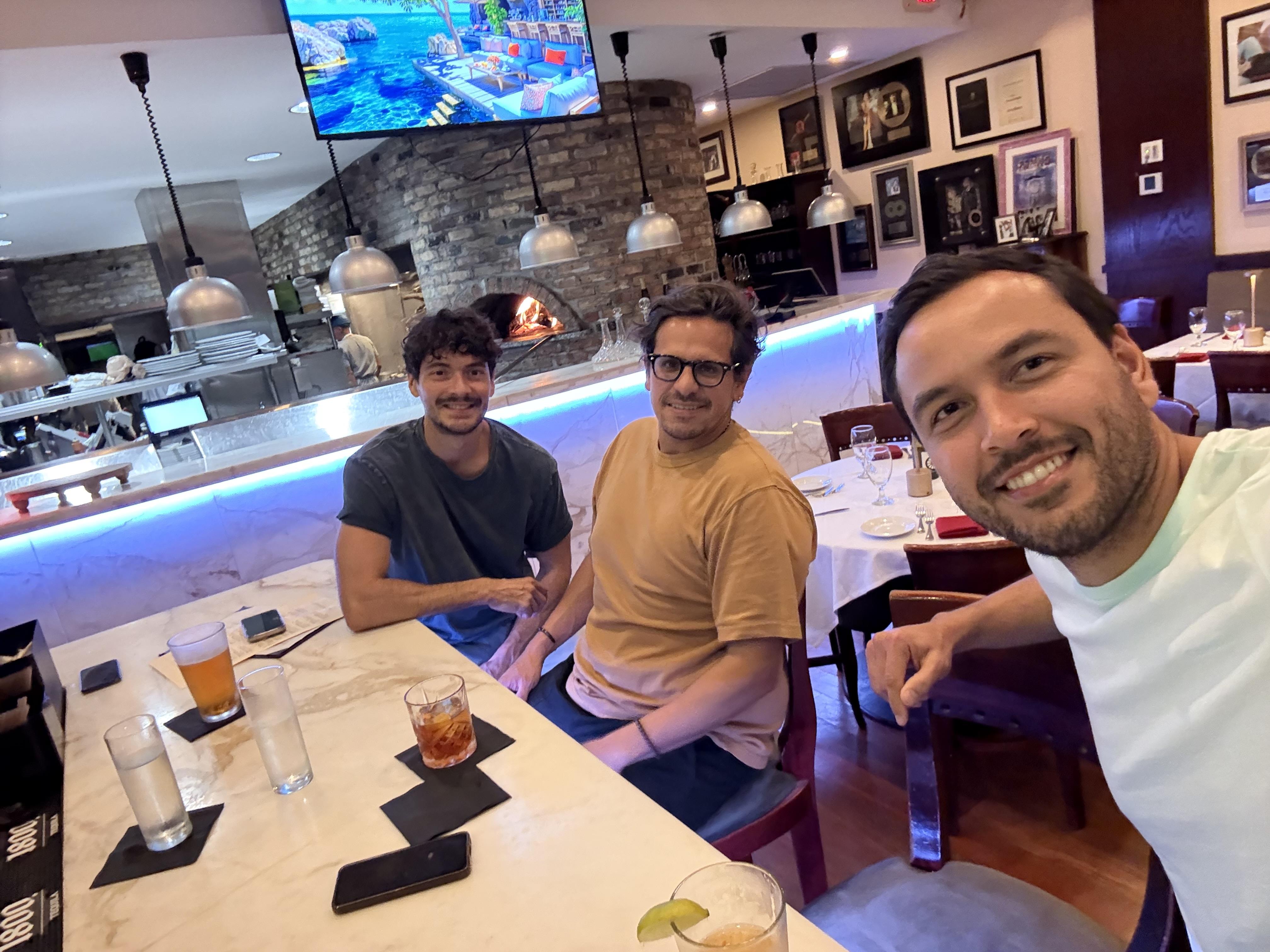 A group of men sitting at a table