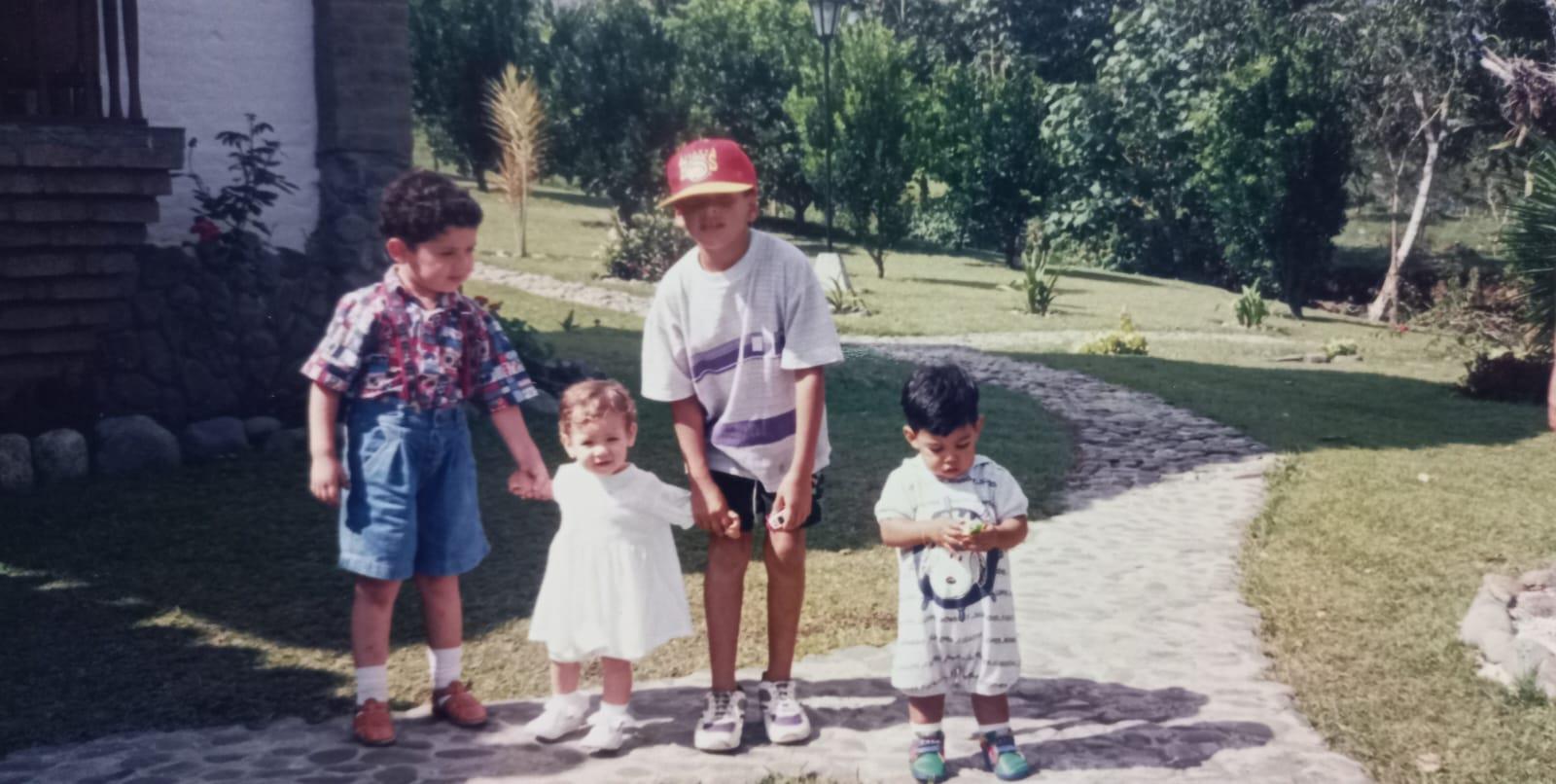 A group of children standing on a path
