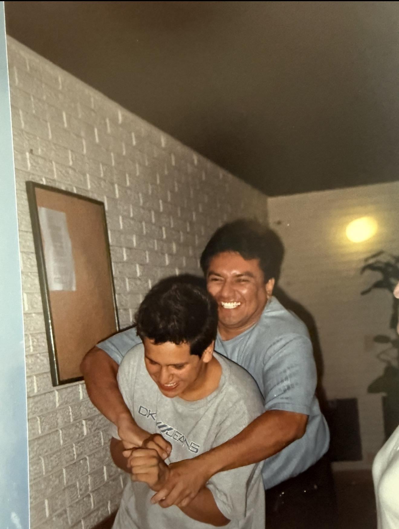 A man holding another man