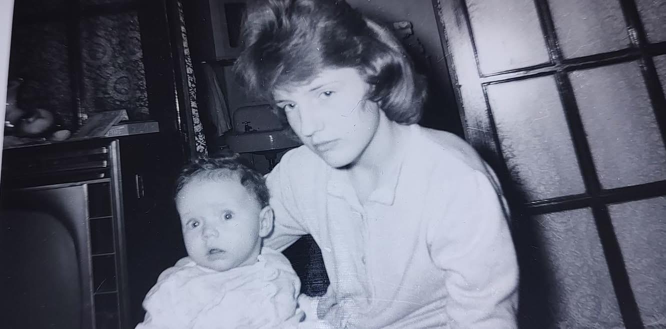 A woman holding a baby