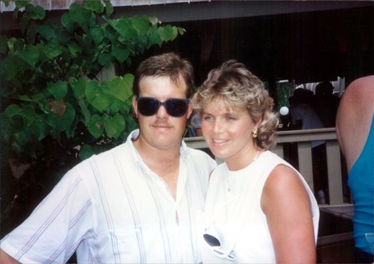 A man and woman posing for a picture