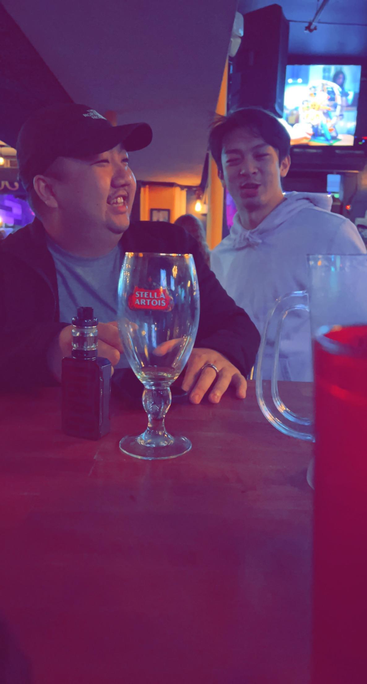 A group of men sitting at a table