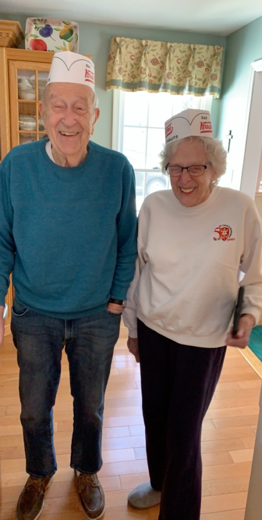 A man and woman wearing hats