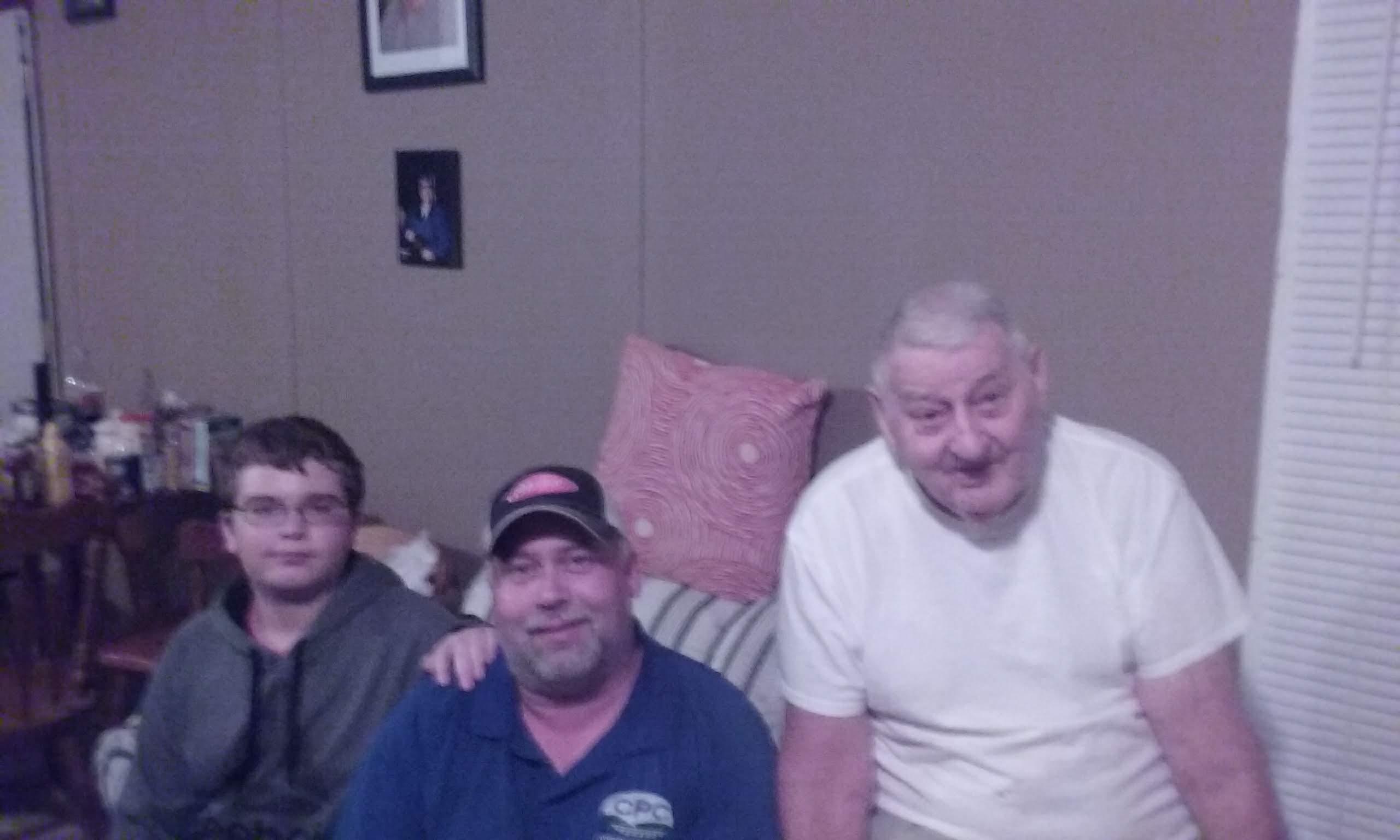 A group of men sitting on a couch