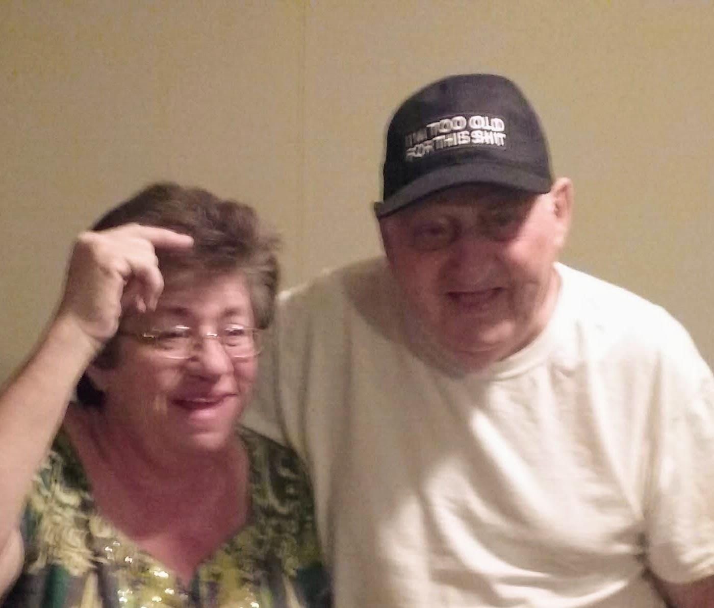 A man and woman posing for a picture