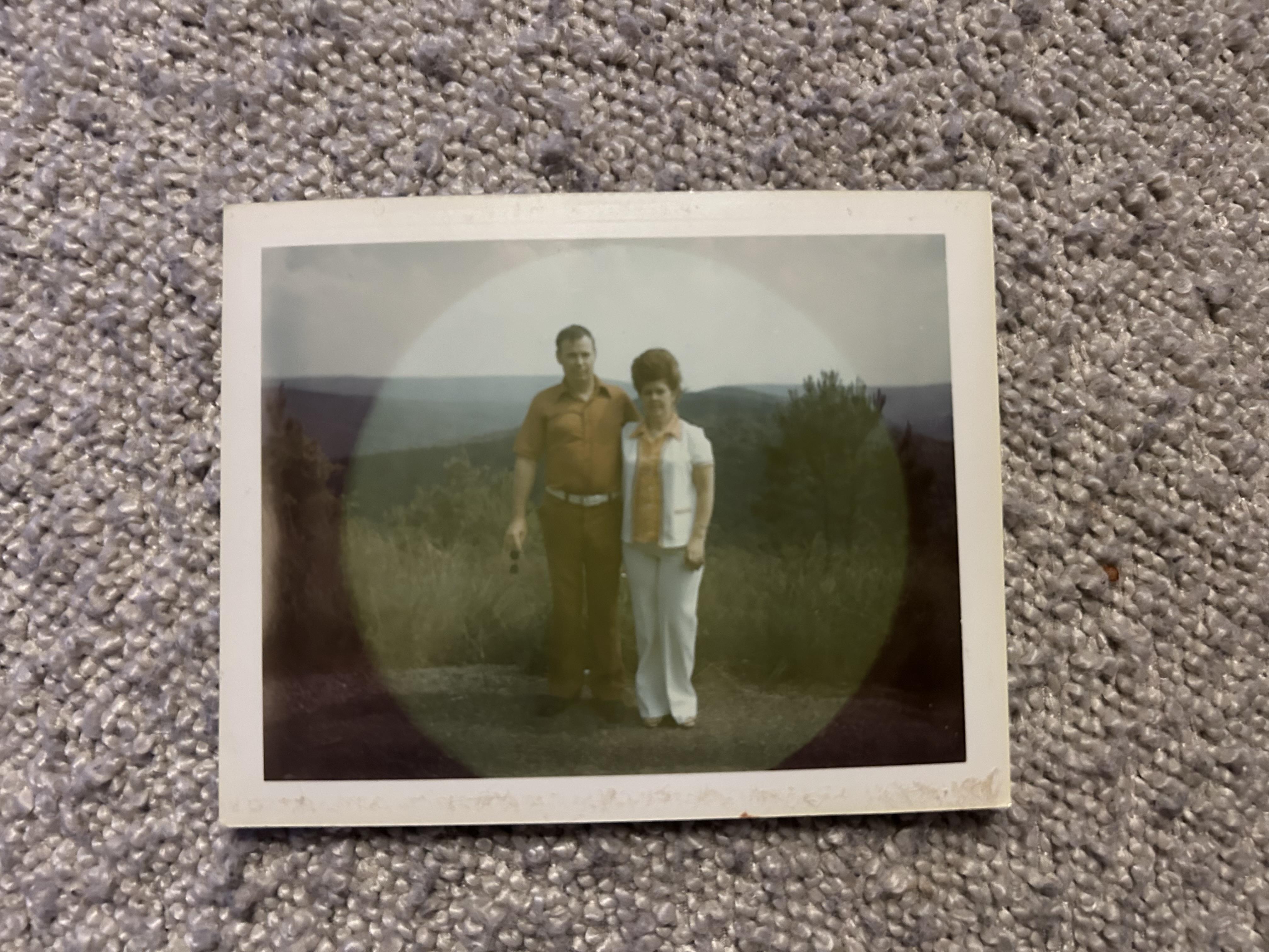 A man and woman standing on a carpet