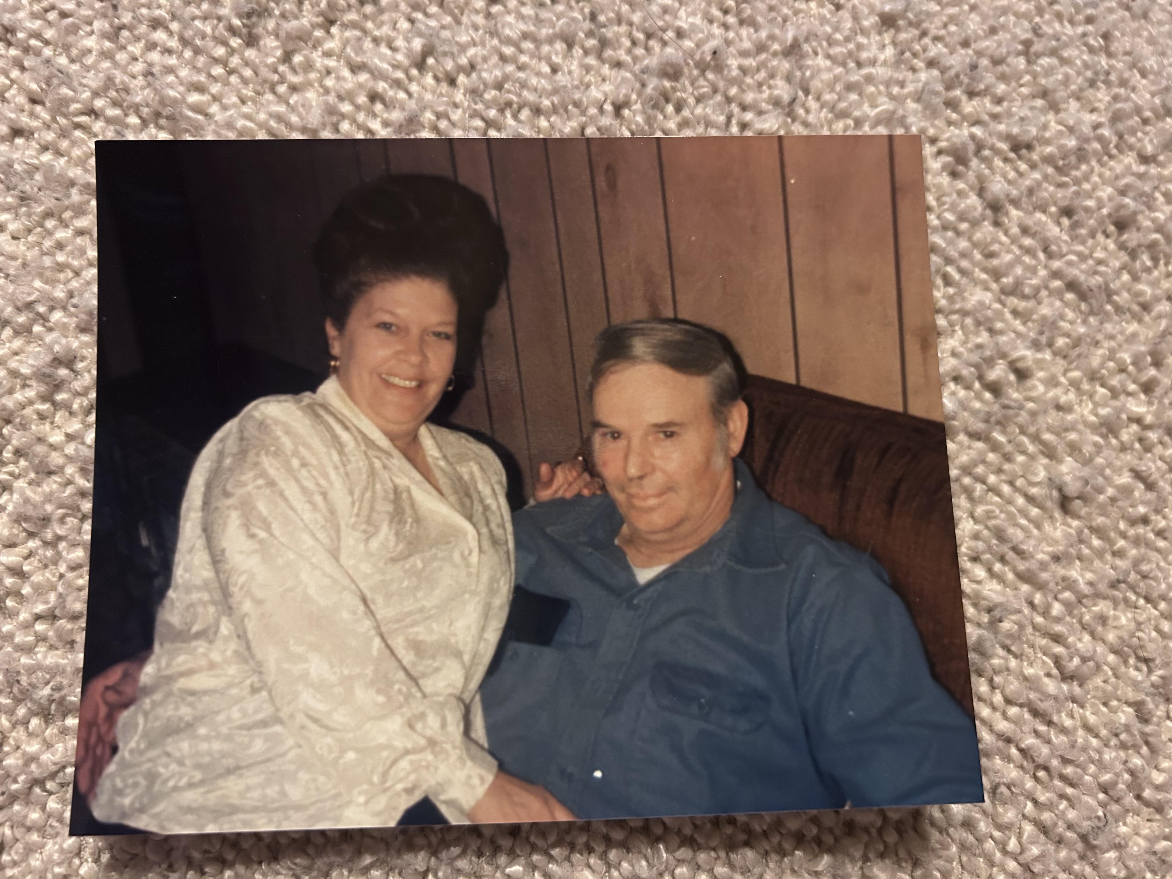 A man and woman sitting on a couch