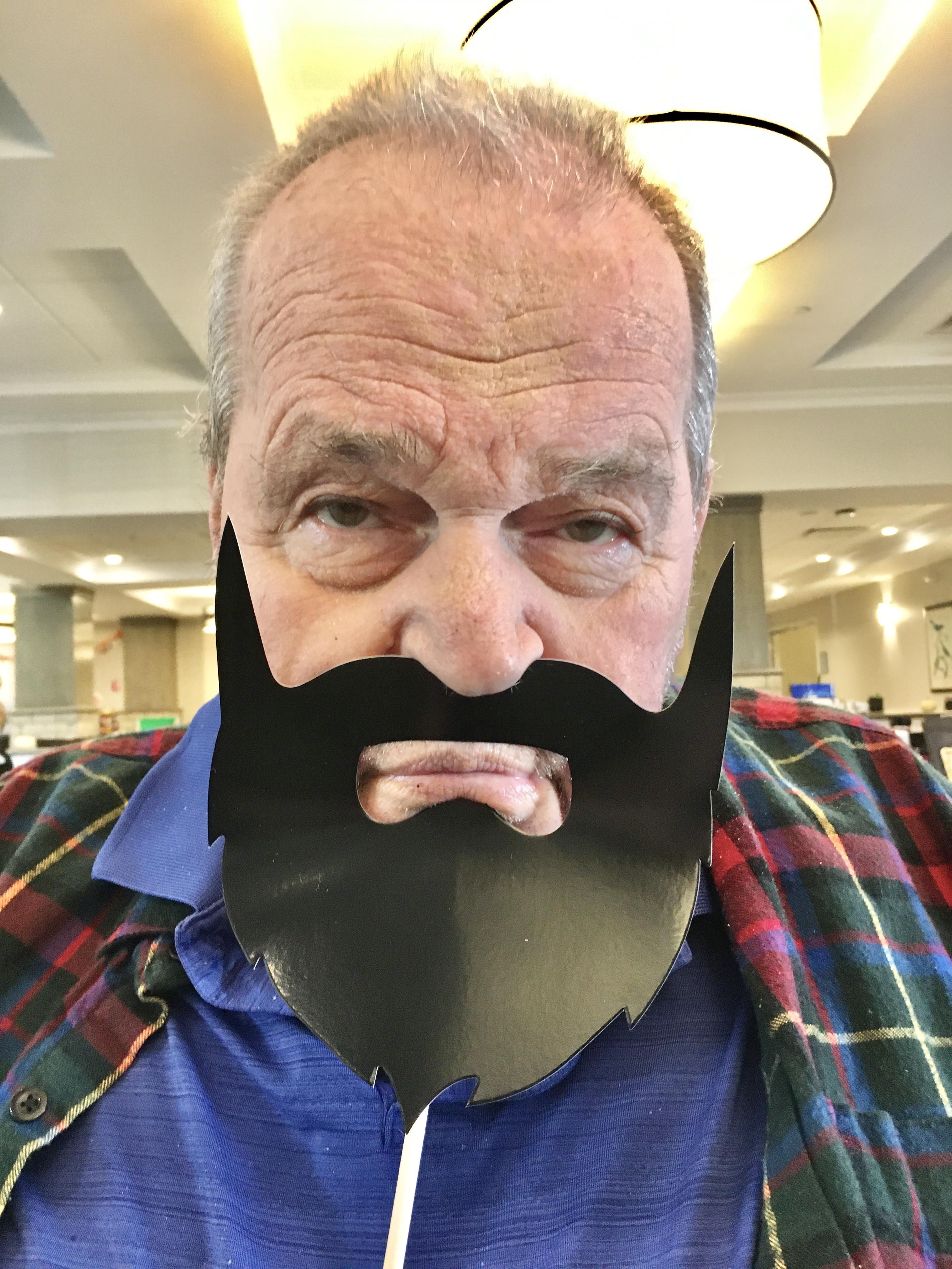 A man with a fake beard