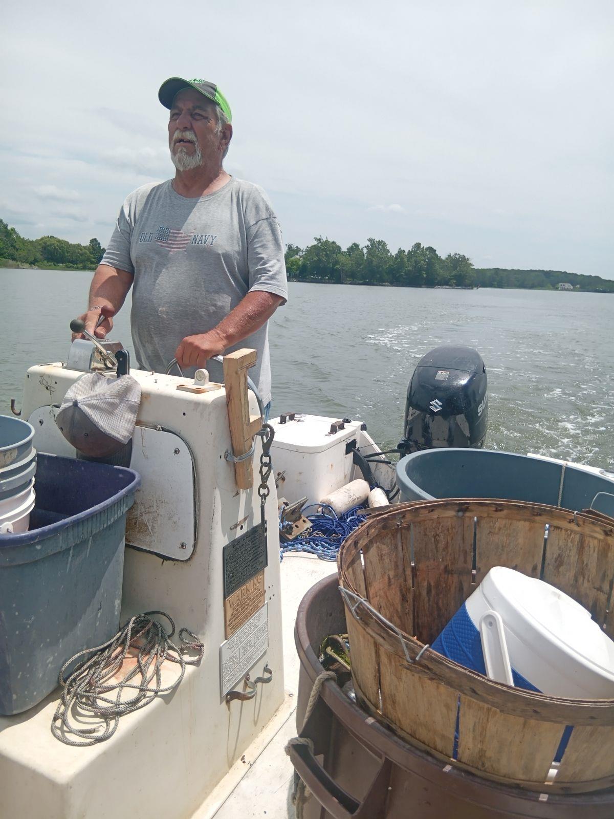 A man on a boat with buckets