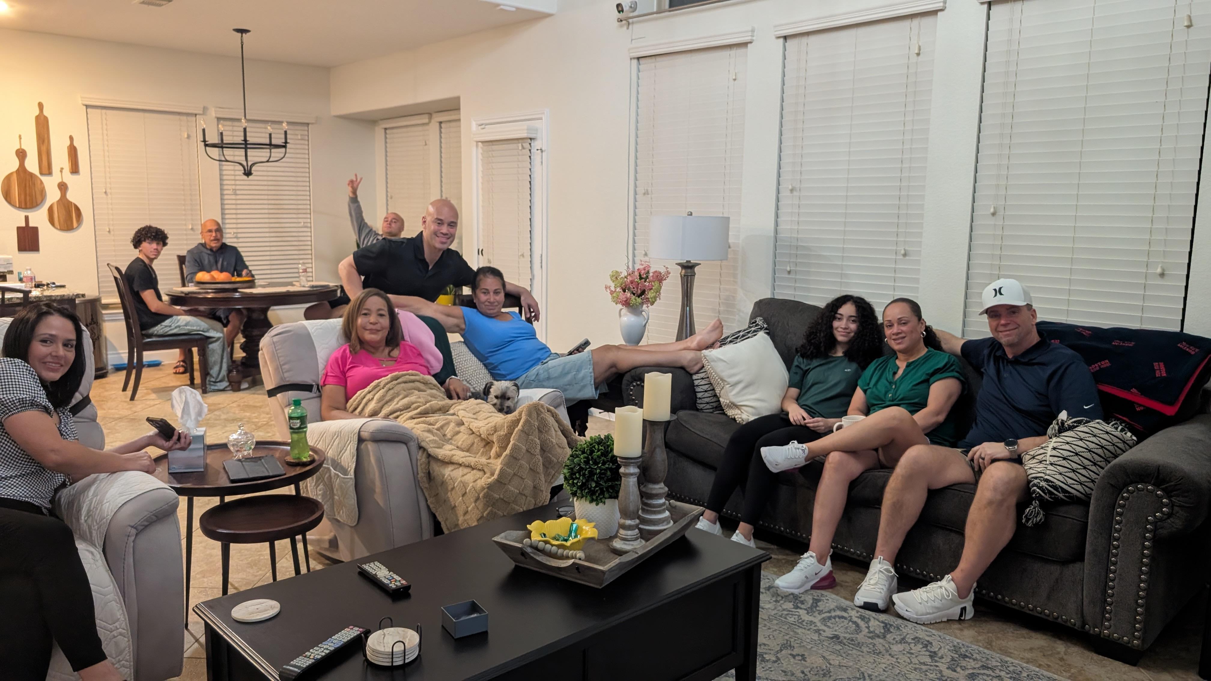 A group of people sitting on couches in a living room