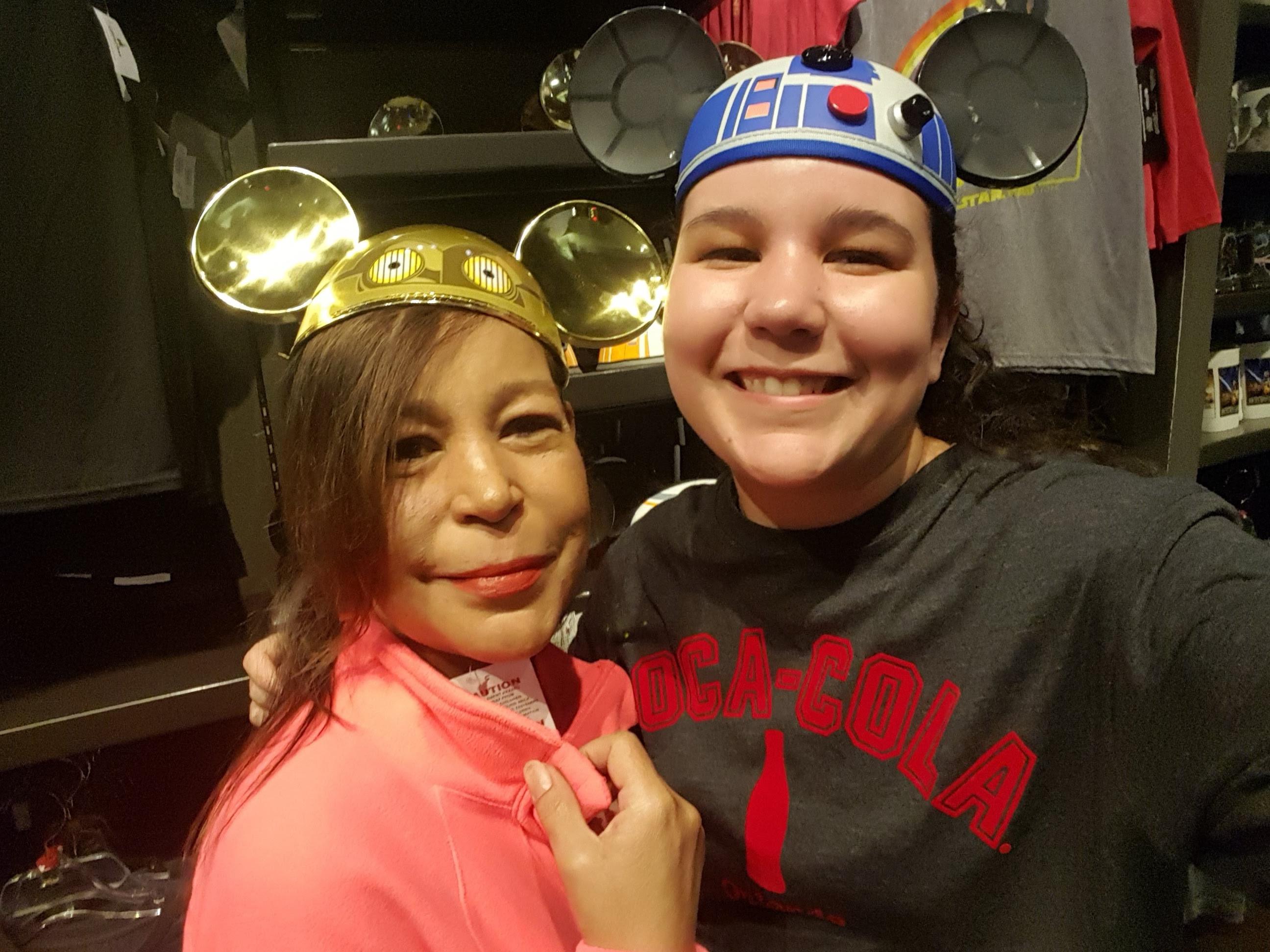Two women wearing hats