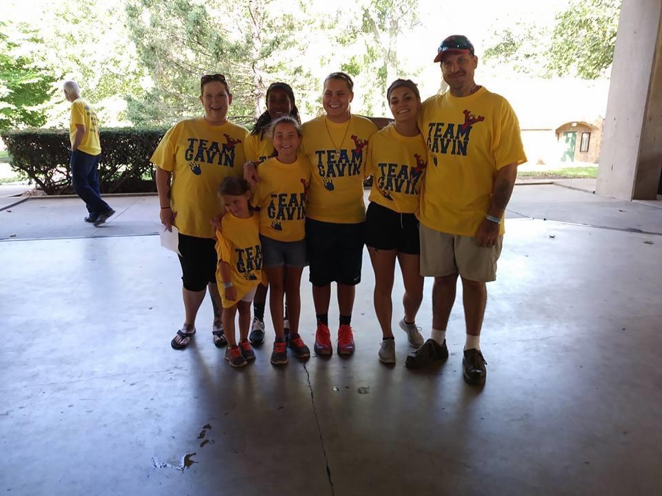 A group of people wearing matching shirts