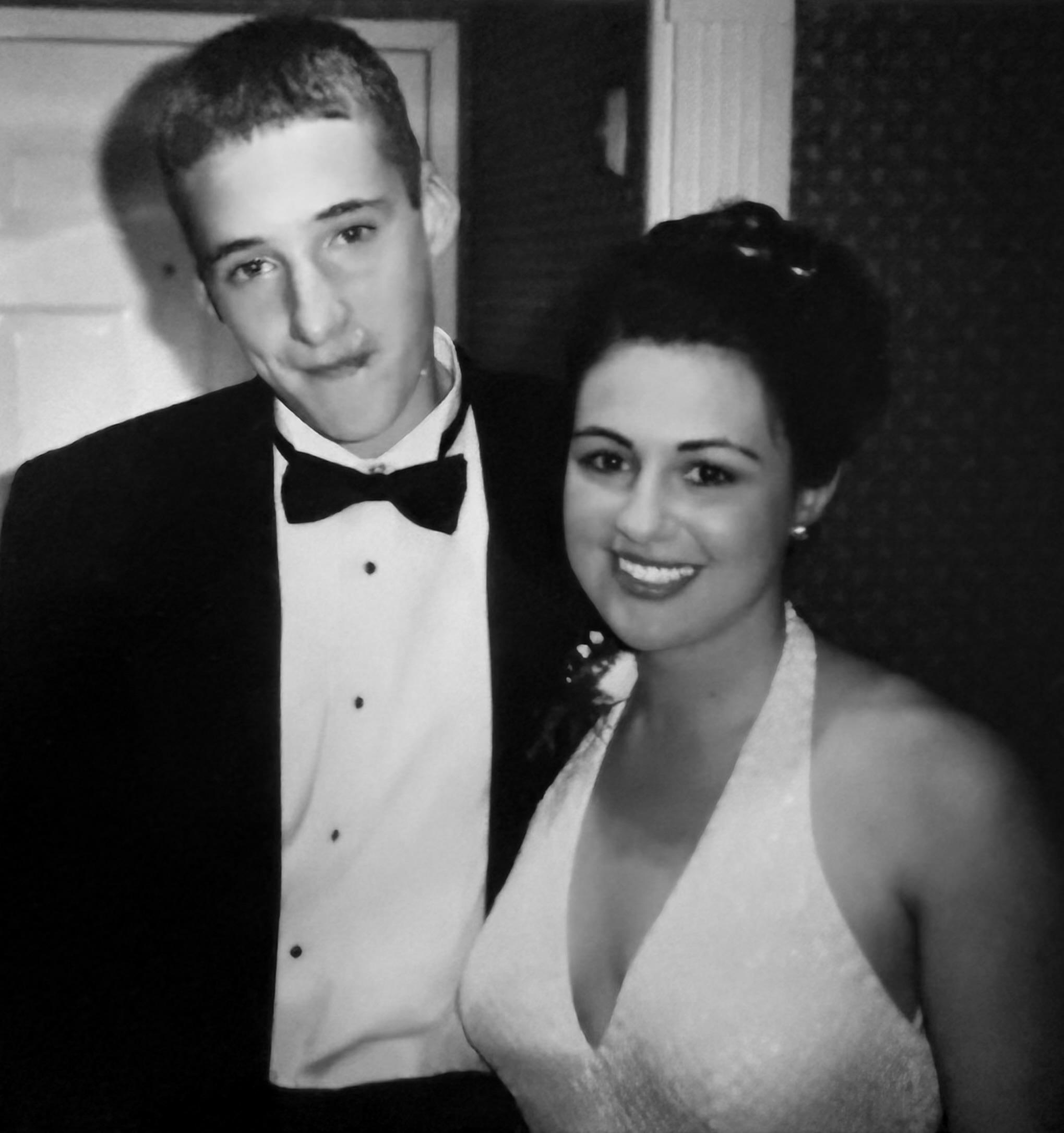 A man and woman posing for a picture