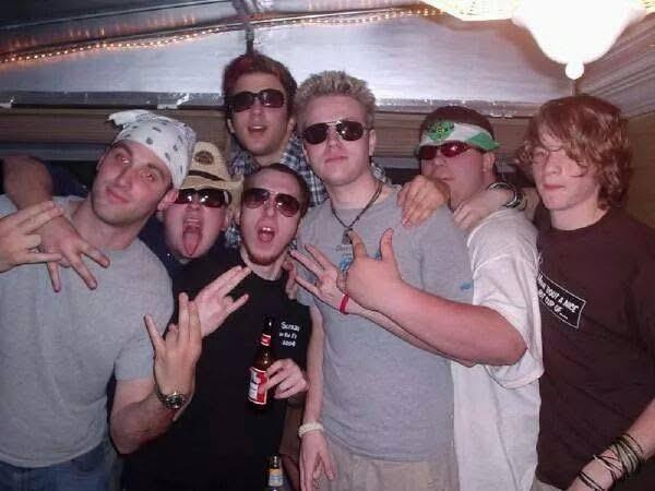 A group of men posing for a photo