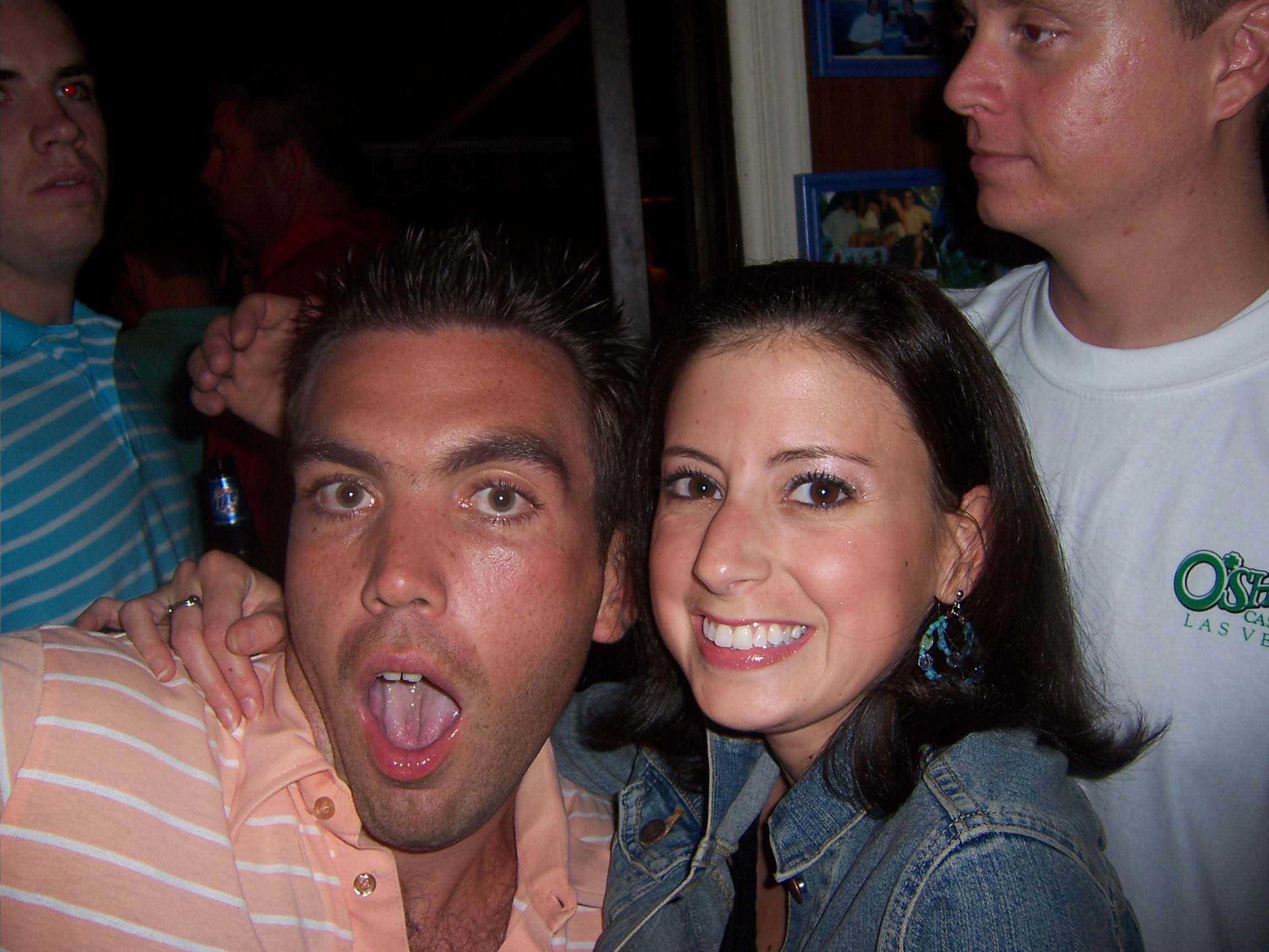 A man and woman posing for a picture