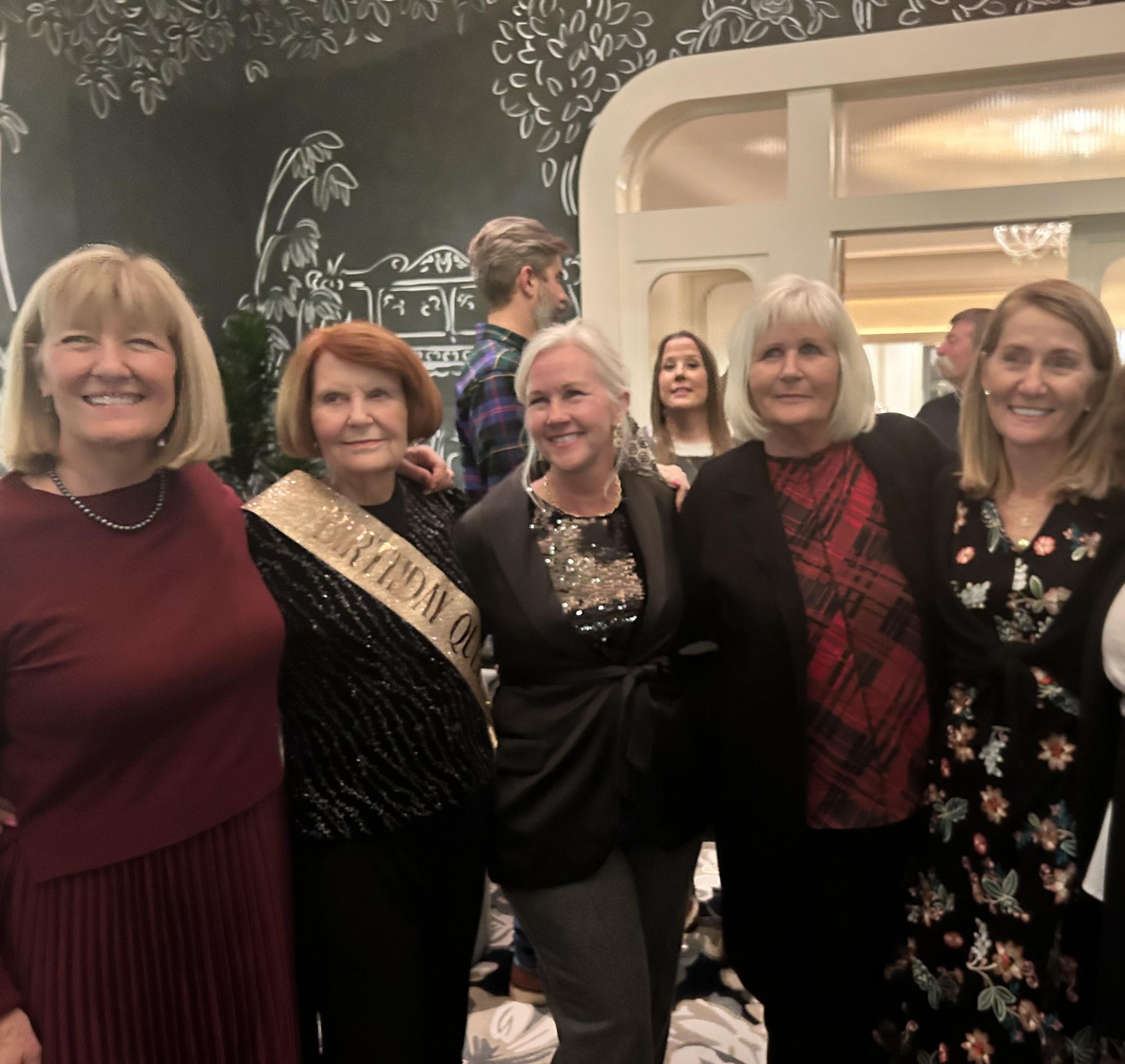 A group of women posing for a photo