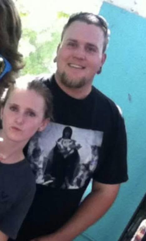 A man and woman posing for a picture